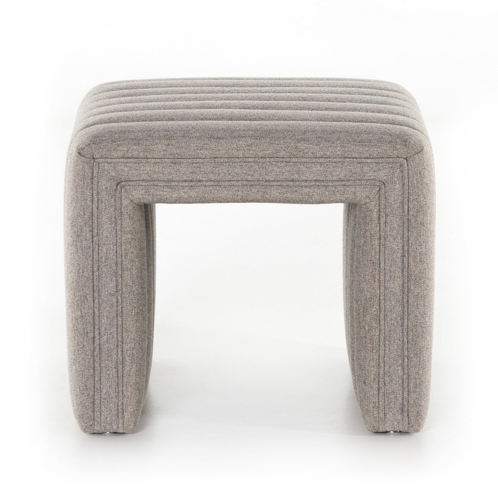 We love the dramatic channeling of this Augustine Ottoman - Orly Natural. Match it with the Augustine Swivel and complete the whole space!  Overall Dimensions: 21.50"w x 21.00"d x 18.00"h  Colors: Orly Natural Materials: 100% Polyester