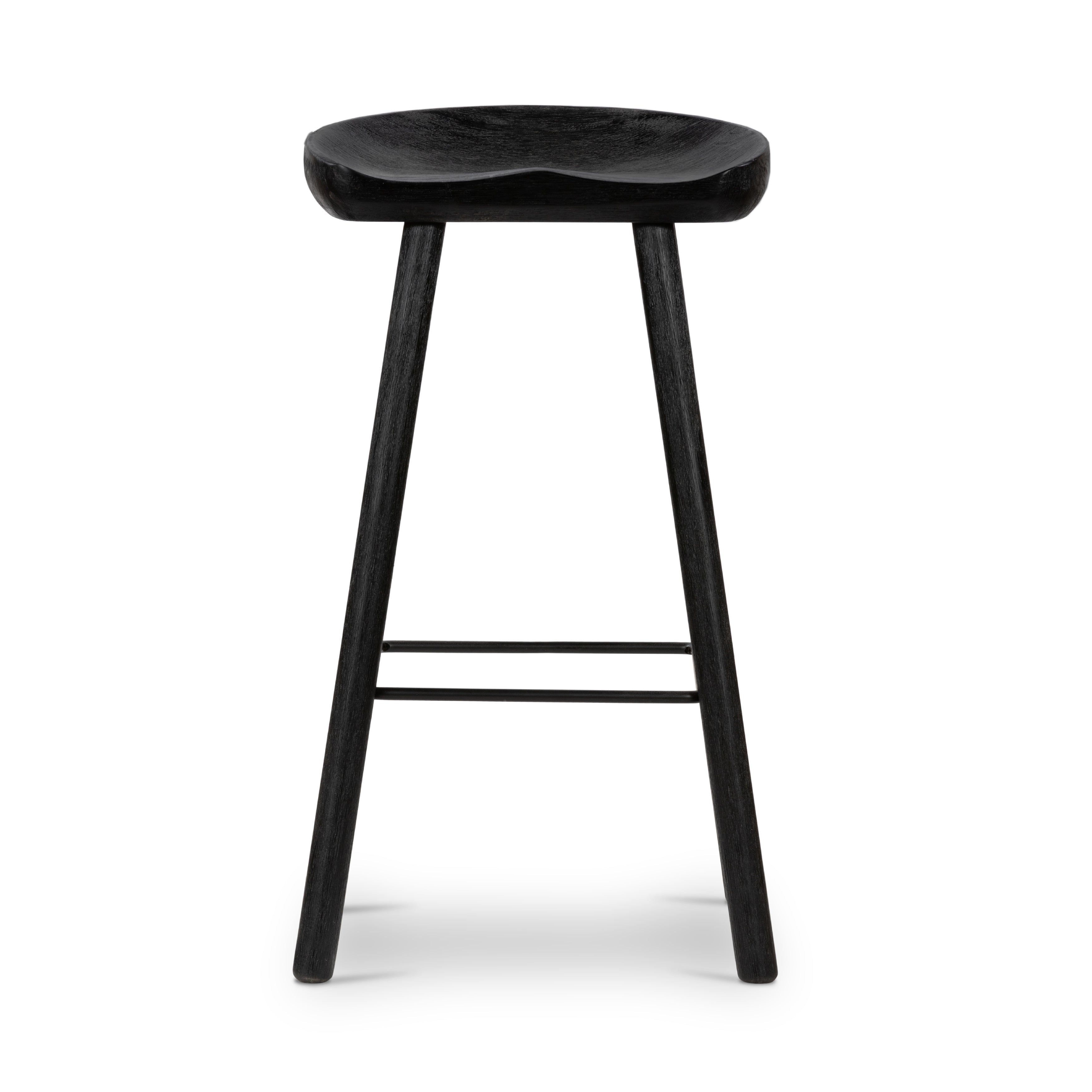 The Barrett Matte Black Bar and Counter Stool is sculpted for comfort. Crafted from rich parawood, black iron stretchers lend an updated look to simply styled bar or counter seating finished in a sleek matte black. Amethyst Home provides interior design, new home construction design consulting, vintage area rugs, and lighting in the Salt Lake City metro area.
