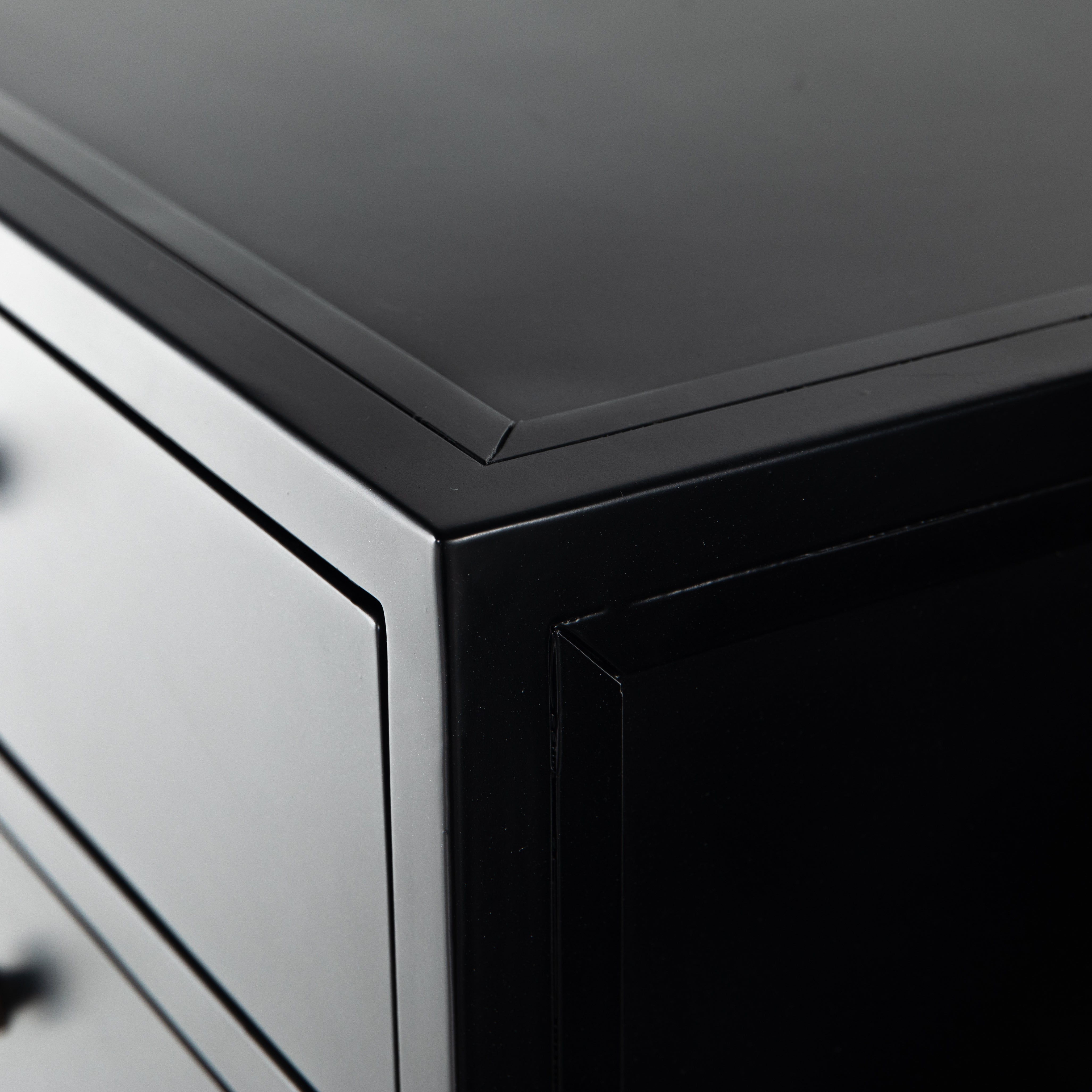 Sleek and industrial-inspired, this Belmont 8 Drawer Tall Dresser has black iron that forms a tall, spacious eight-drawers dresser. The brass knobs bring a cool contrast to any bedroom.   Overall Dimensions: 35.50"w x 19.75"d x 48.00"h  Colors: Black Materials: Iron