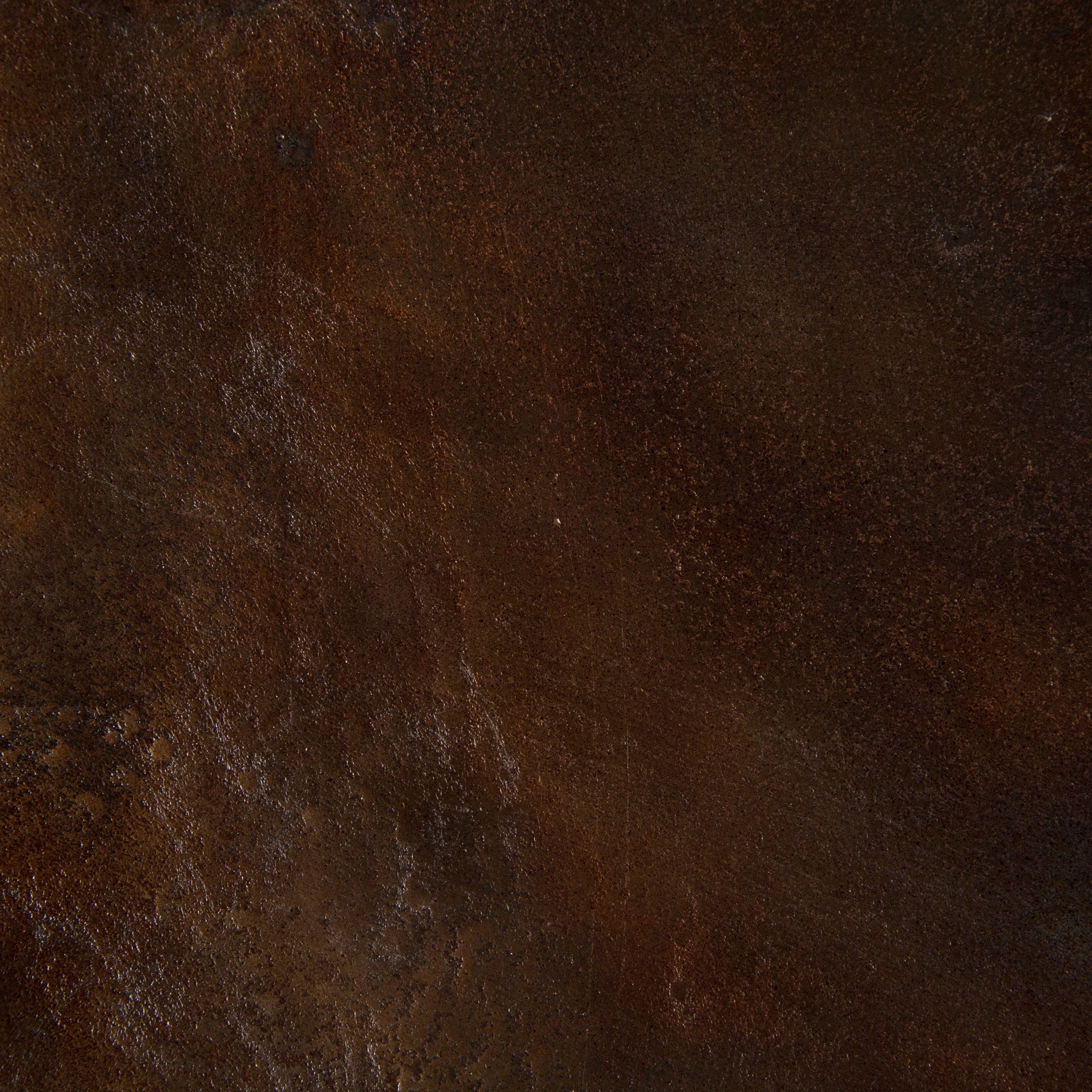 This Cruz Coffee Table - Antique Rust has a textured look finished in gorgeous antique rust. Safe for outdoor spaces — cover or store indoors during inclement weather and when not in use.  Overall Dimensions: 38.00"w x 38.00"d x 15.25"h