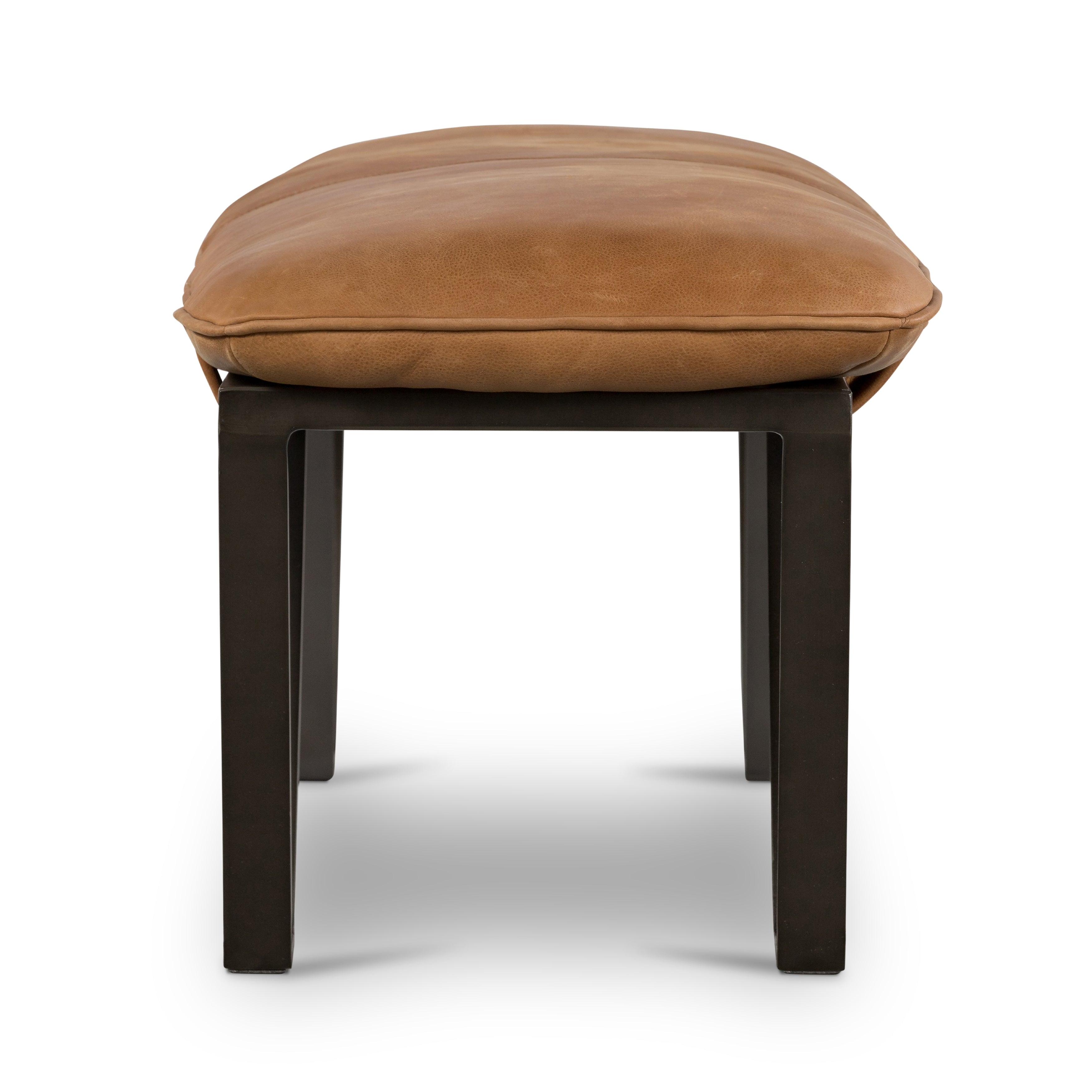 The Darrow Bench -  Palermo Cognac is a time-honored bench, reinvented. With fresh, clever shaping, angular gunmetal-finished iron supports spare-yet-comfortable top-grain leather cushioning in a rich cognac.  Overall Dimensions: 63.50"w x 17.50"d x 17.75"h