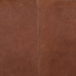 The Darrow Bench -  Palermo Cognac is a time-honored bench, reinvented. With fresh, clever shaping, angular gunmetal-finished iron supports spare-yet-comfortable top-grain leather cushioning in a rich cognac.  Overall Dimensions: 63.50"w x 17.50"d x 17.75"h