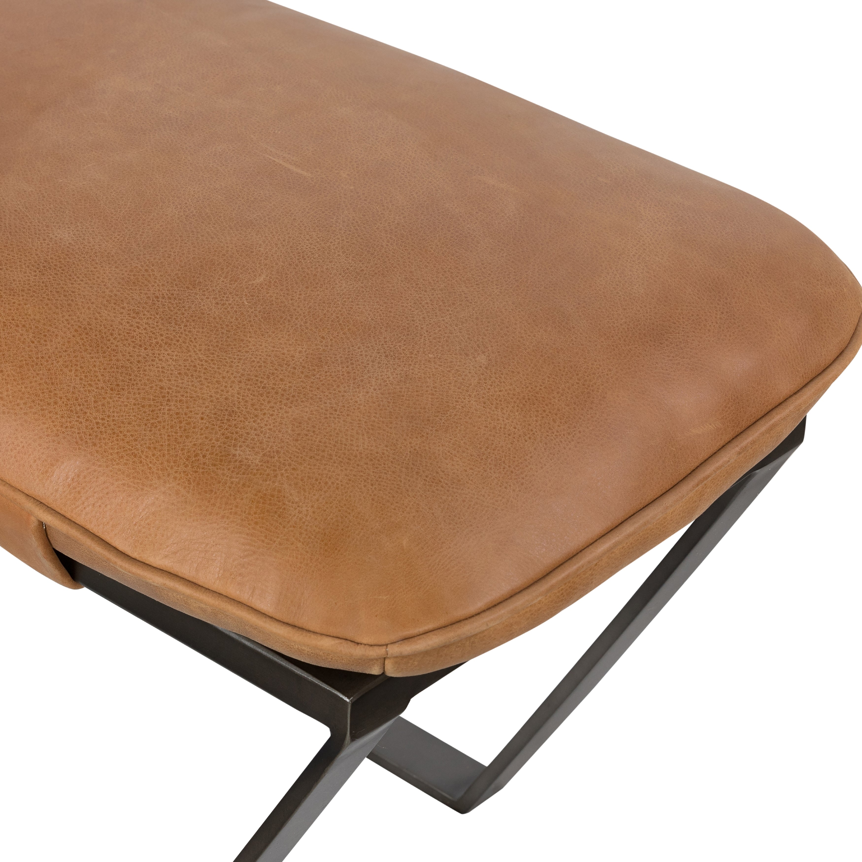 The Darrow Bench -  Palermo Cognac is a time-honored bench, reinvented. With fresh, clever shaping, angular gunmetal-finished iron supports spare-yet-comfortable top-grain leather cushioning in a rich cognac.  Overall Dimensions: 63.50"w x 17.50"d x 17.75"h