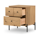 This Eaton Nightstand - Light Oak has a gorgeous, thick oak veneer with thin, iron legs. With one large drawer and two smaller drawers, this is the perfect nightstand to complete your bedroom.   Overall Dimensions: 23.50"w x 18.50"d x 26.00"h Colors: Dark Gunmetal, Light Oak Resin Materials: Iron, Thick Oak Veneer