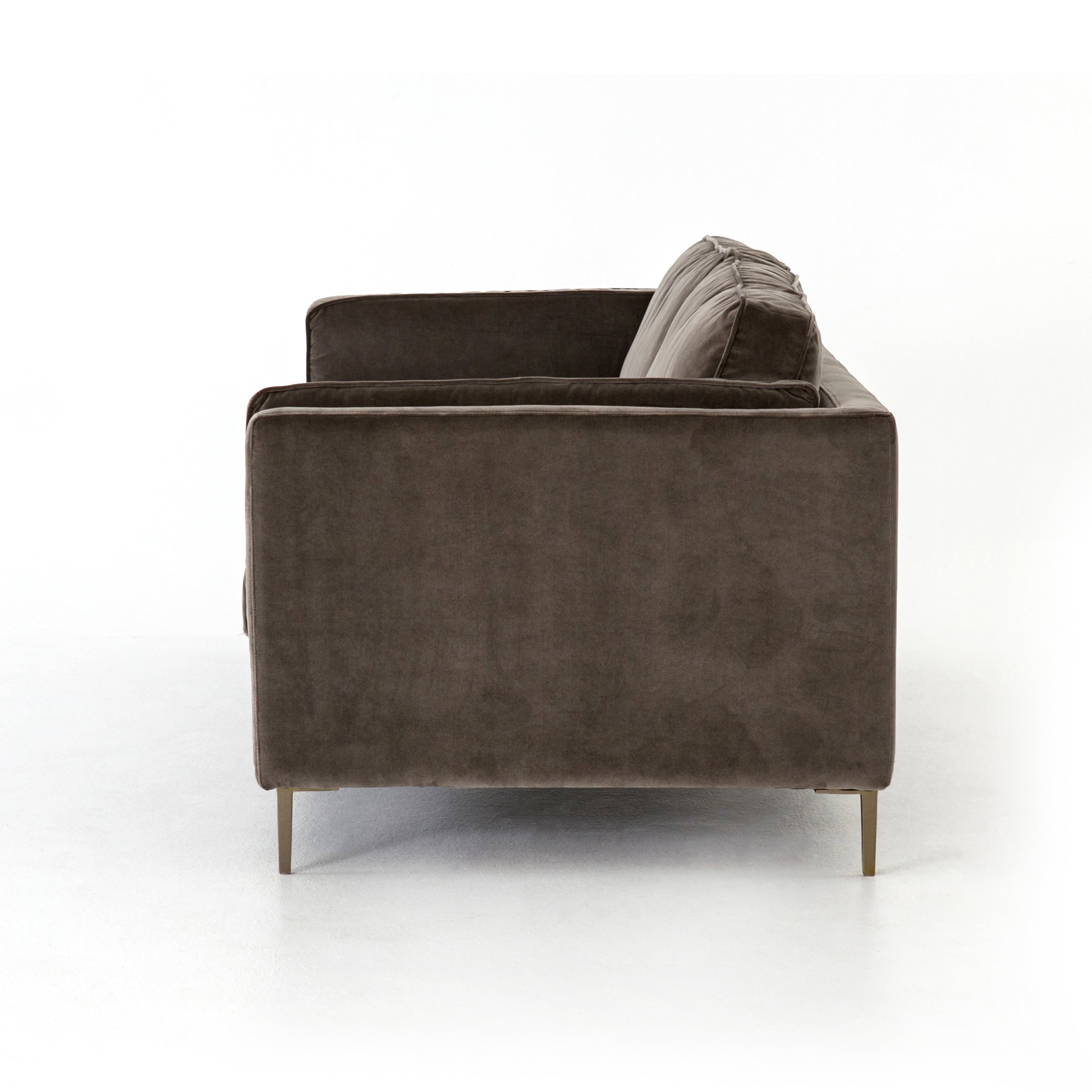 Featuring Emery Sofa - Sapphire Birch by Four Hands at Amethyst Home. We love the plush brich-grey upholstery of this Emery Sofa - Sapphire Birch. The slim legs are finished in a gorgeous antique brass, for a sophisticated look for any living room or lounge area. 
Overall Dimensions: 84"W x 36"L x 33"HColors: Sapphire Birch, Antique BrassMaterials: 92%Pl, 5%Co.  Amethyst Home provides interior design, new home construction design consulting, vintage area rugs, and lighting in the Tampa metro area.