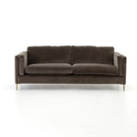 Featuring Emery Sofa - Sapphire Birch by Four Hands at Amethyst Home. We love the plush brich-grey upholstery of this Emery Sofa - Sapphire Birch. The slim legs are finished in a gorgeous antique brass, for a sophisticated look for any living room or lounge area. 
Overall Dimensions: 84"W x 36"L x 33"HColors: Sapphire Birch, Antique BrassMaterials: 92%Pl,.  Amethyst Home provides interior design, new home construction design consulting, vintage area rugs, and lighting in the Washington metro area.