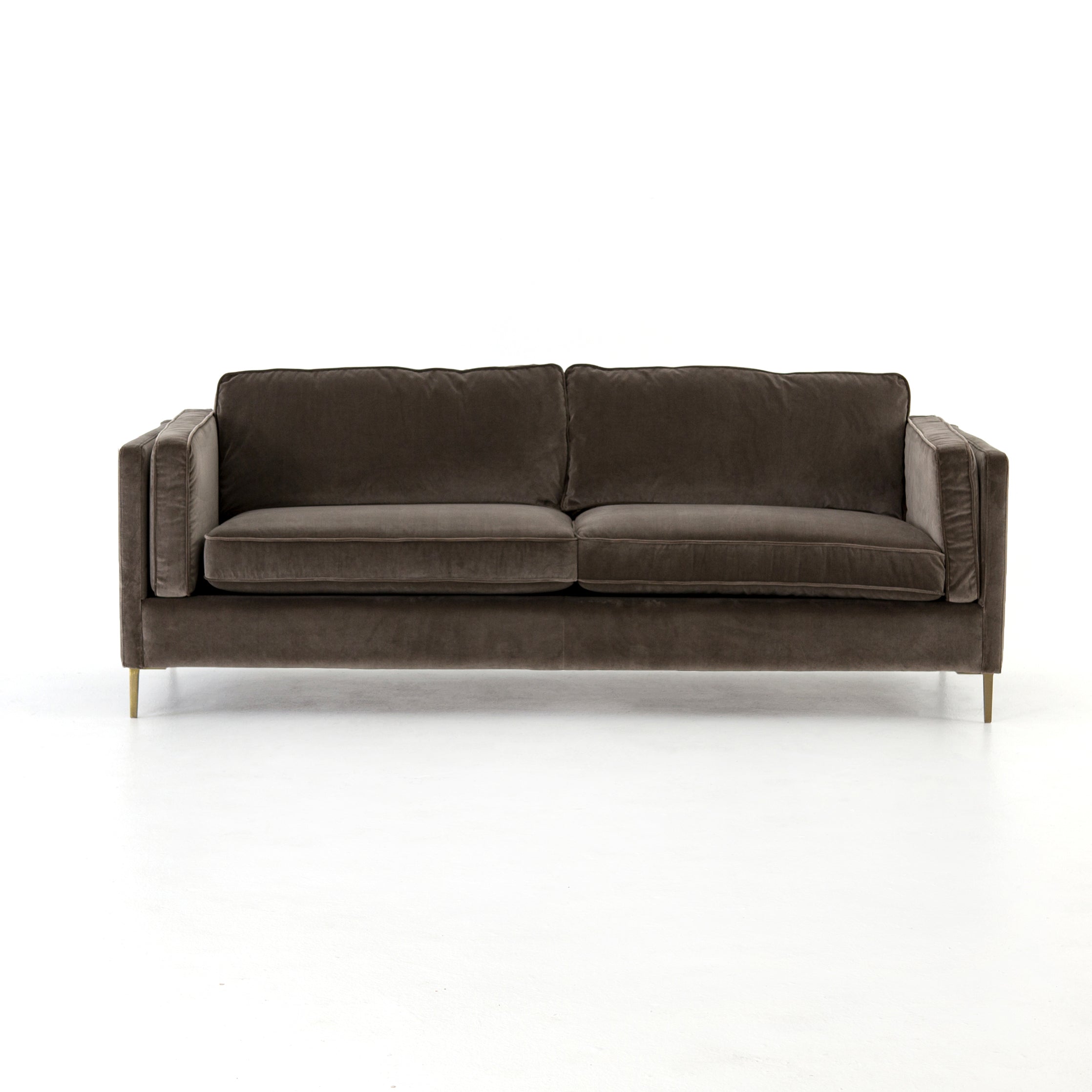 Featuring Emery Sofa - Sapphire Birch by Four Hands at Amethyst Home. We love the plush brich-grey upholstery of this Emery Sofa - Sapphire Birch. The slim legs are finished in a gorgeous antique brass, for a sophisticated look for any living room or lounge area. 
Overall Dimensions: 84"W x 36"L x 33"HColors: Sapphire Birch, Antique BrassMaterials: 92%Pl,.  Amethyst Home provides interior design, new home construction design consulting, vintage area rugs, and lighting in the Washington metro area.