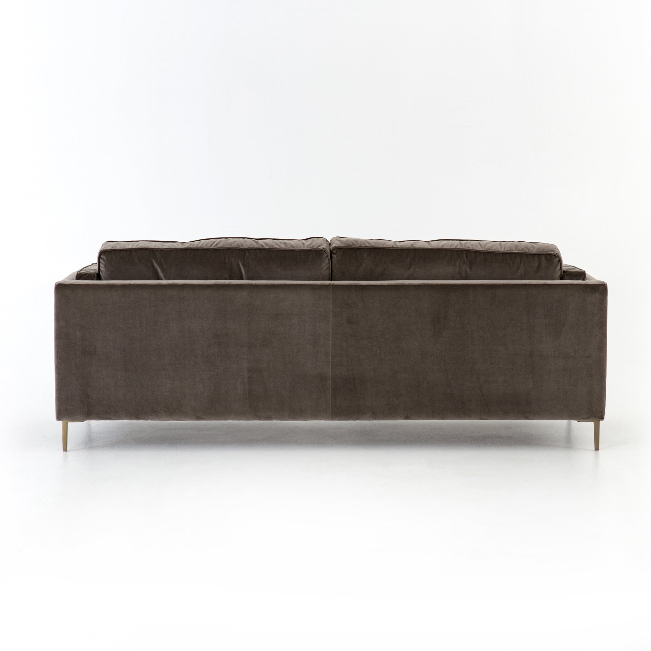Featuring Emery Sofa - Sapphire Birch by Four Hands at Amethyst Home. We love the plush brich-grey upholstery of this Emery Sofa - Sapphire Birch. The slim legs are finished in a gorgeous antique brass, for a sophisticated look for any living room or lounge area. 
Overall Dimensions: 84"W x 36"L x 33"HColors: Sapphire Birch, Antique BrassMaterials: 92%Pl, 5%Co.  Amethyst Home provides interior design, new home construction design consulting, vintage area rugs, and lighting in the Miami metro area.
