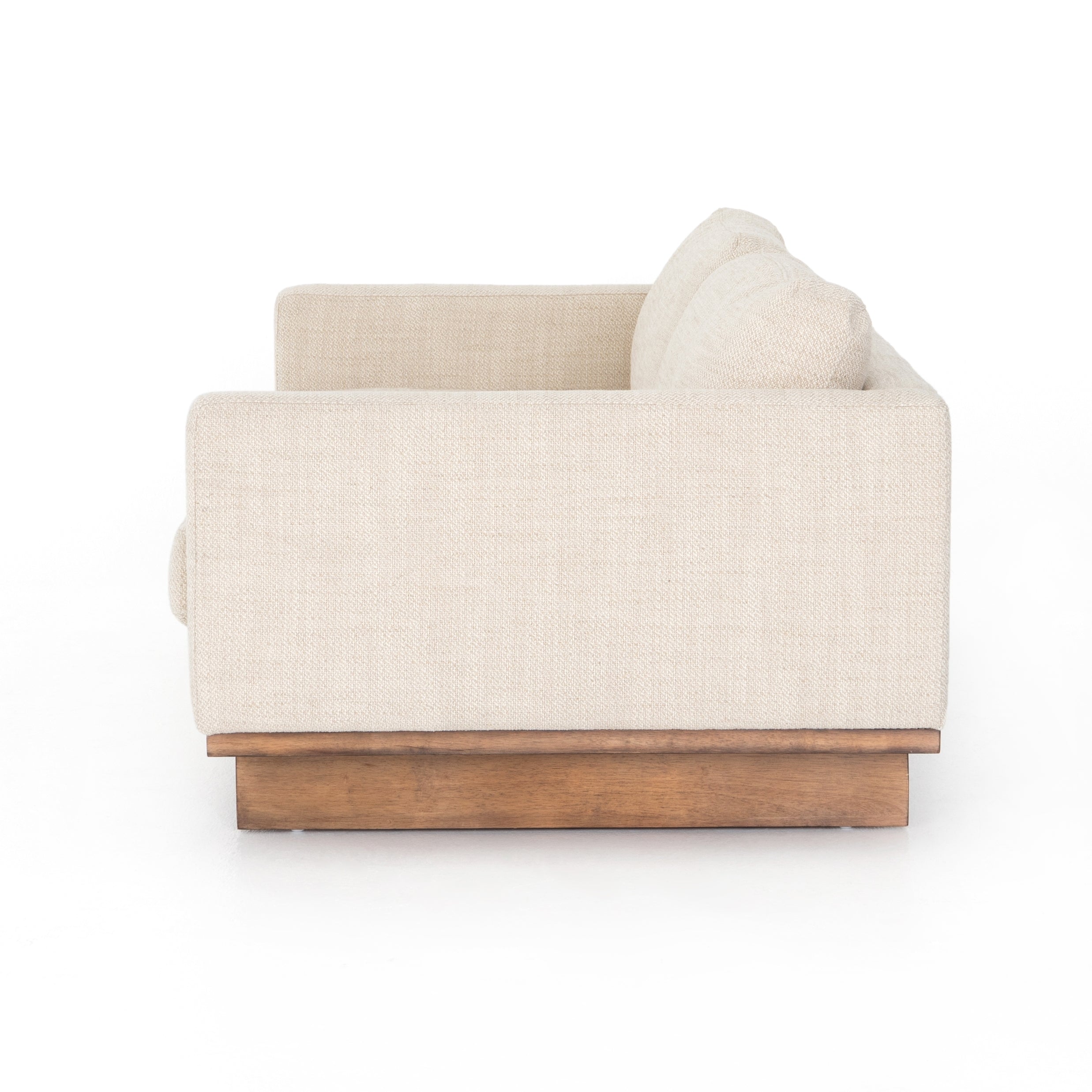 Classic goes contemporary with this Everly Sofa - Irving Taupe. A cocoa-finished parawood base supports low, deep seating of performance-grade upholstery in an invitingly neutral taupe, with track arms for a clean touch for any living room or lounge area.   Overall Dimensions: 84.00"w x 43.00"d x 32.00"h