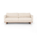 Classic goes contemporary with this Everly Sofa - Irving Taupe. A cocoa-finished parawood base supports low, deep seating of performance-grade upholstery in an invitingly neutral taupe, with track arms for a clean touch for any living room or lounge area.   Overall Dimensions: 84.00"w x 43.00"d x 32.00"h