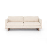 Classic goes contemporary with this Everly Sofa - Irving Taupe. A cocoa-finished parawood base supports low, deep seating of performance-grade upholstery in an invitingly neutral taupe, with track arms for a clean touch for any living room or lounge area.   Overall Dimensions: 84.00"w x 43.00"d x 32.00"h