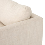 Classic goes contemporary with this Everly Sofa - Irving Taupe. A cocoa-finished parawood base supports low, deep seating of performance-grade upholstery in an invitingly neutral taupe, with track arms for a clean touch for any living room or lounge area.   Overall Dimensions: 84.00"w x 43.00"d x 32.00"h