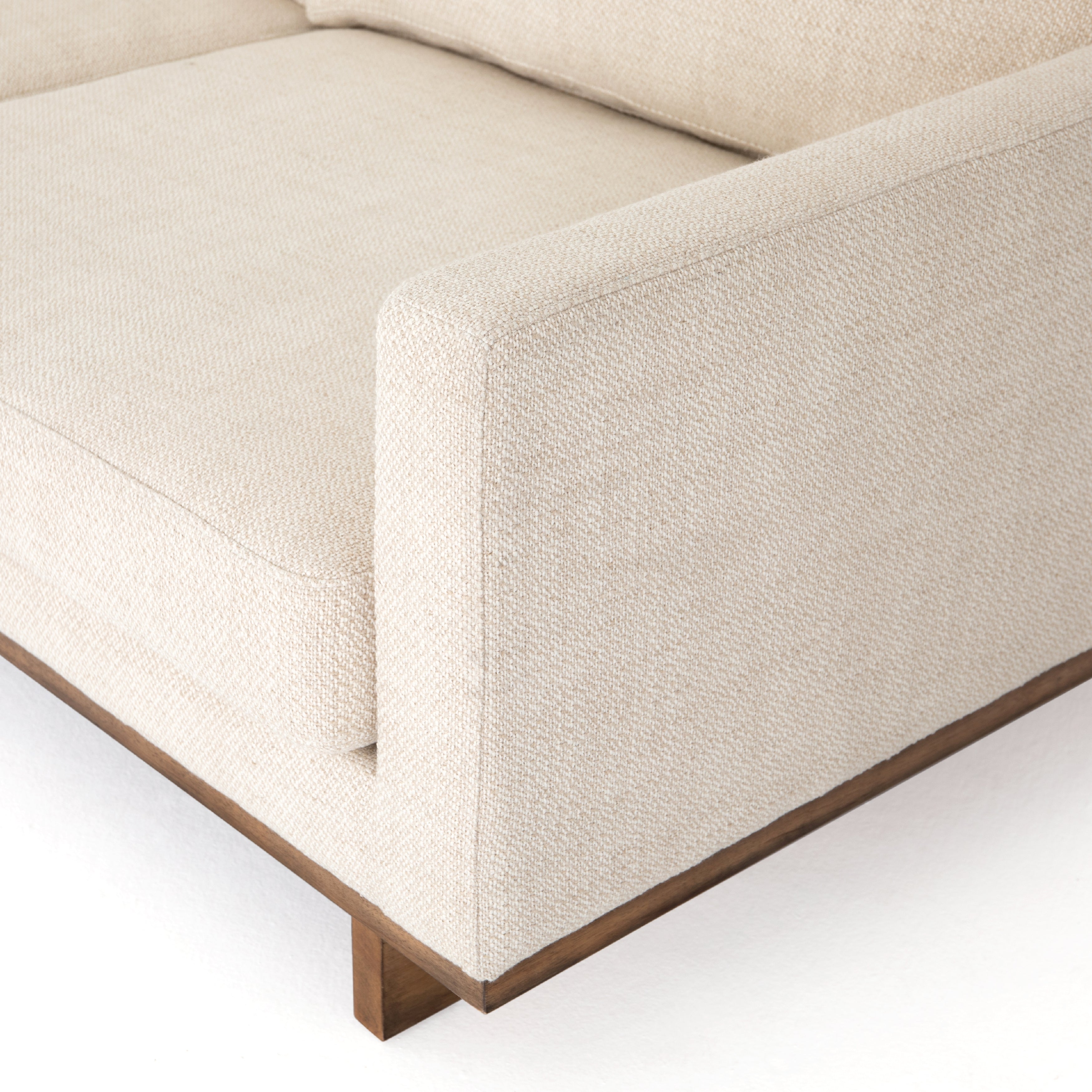 Classic goes contemporary with this Everly Sofa - Irving Taupe. A cocoa-finished parawood base supports low, deep seating of performance-grade upholstery in an invitingly neutral taupe, with track arms for a clean touch for any living room or lounge area.   Overall Dimensions: 84.00"w x 43.00"d x 32.00"h