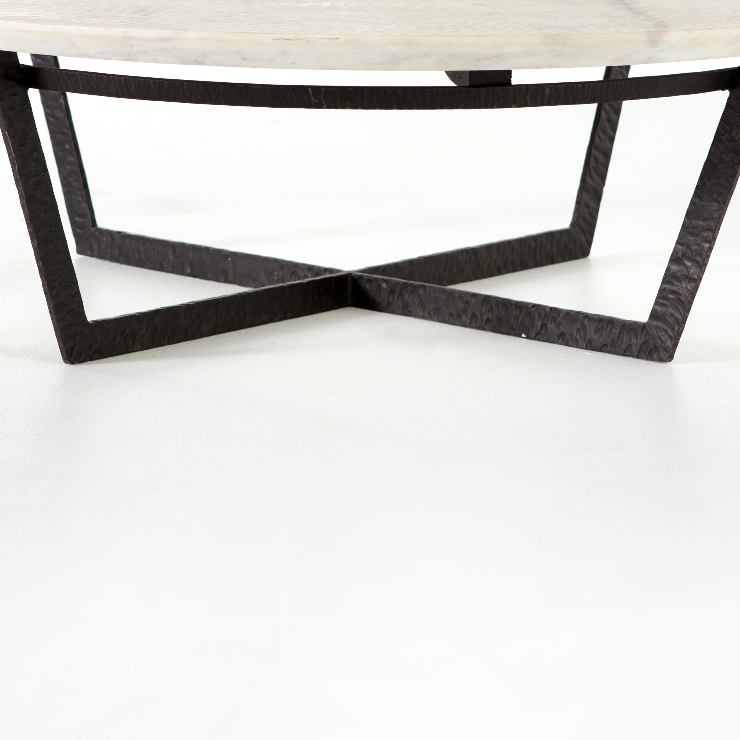 Featuring Felix Round Coffee Table - Sandblasted White Marble by Four Hands at Amethyst Home. We love the textured top and geometric base of this Felix Round Coffee Table - Sandblasted White Marble. Place in your living room or lounge area to bring a sophisticated look to the space. 
Overall Dimensions: 48"W x 48"L x 15"H
Colors: Rustic Fossil, Sandbla.  Amethyst Home provides interior design, new home construction design consulting, vintage area rugs, and lighting in the Newport Beach metro area.