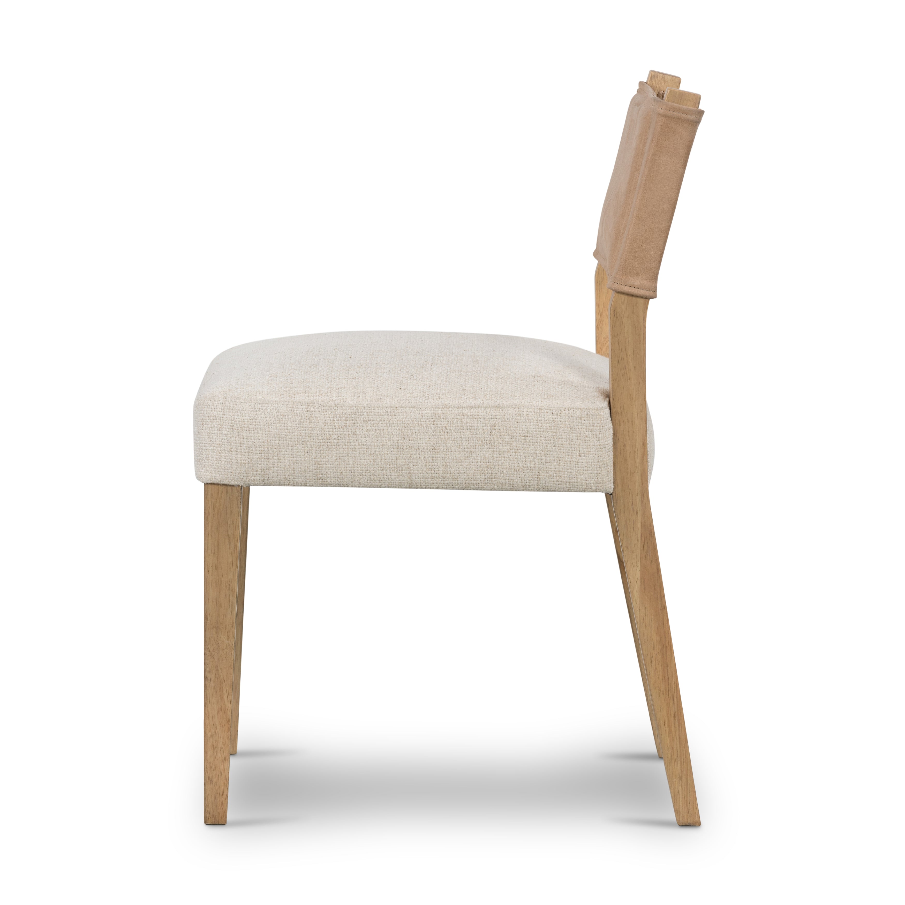 We love the mixed materials found on this Ferris Dining Chair - Winchester Beige. Solid parawood forms a slight, simple frame for squared seating upholstered in high-performance fabric. Tan top-grain leather backing takes this modern-minded dining chair to the next level.  Overall Dimensions: 20.00"w x 21.75"d x 32.00"h
