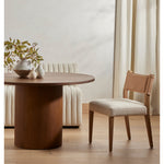 We love the mixed materials found on this Ferris Dining Chair - Winchester Beige. Solid parawood forms a slight, simple frame for squared seating upholstered in high-performance fabric. Tan top-grain leather backing takes this modern-minded dining chair to the next level.  Overall Dimensions: 20.00"w x 21.75"d x 32.00"h