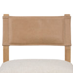 We love the mixed materials found on this Ferris Dining Chair - Winchester Beige. Solid parawood forms a slight, simple frame for squared seating upholstered in high-performance fabric. Tan top-grain leather backing takes this modern-minded dining chair to the next level.  Overall Dimensions: 20.00"w x 21.75"d x 32.00"h