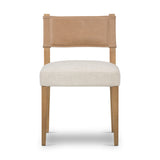 We love the mixed materials found on this Ferris Dining Chair - Winchester Beige. Solid parawood forms a slight, simple frame for squared seating upholstered in high-performance fabric. Tan top-grain leather backing takes this modern-minded dining chair to the next level.  Overall Dimensions: 20.00"w x 21.75"d x 32.00"h