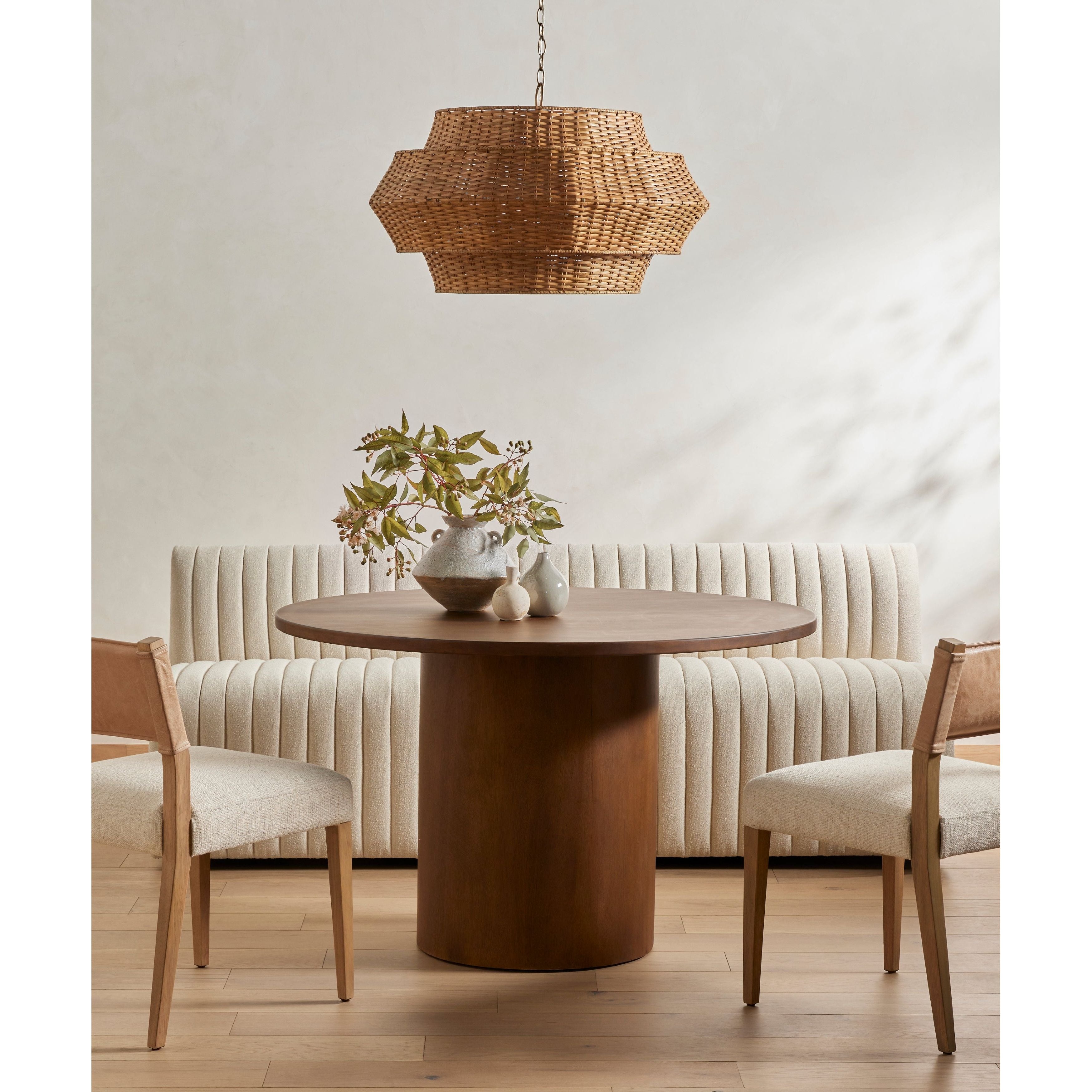 We love the mixed materials found on this Ferris Dining Chair - Winchester Beige. Solid parawood forms a slight, simple frame for squared seating upholstered in high-performance fabric. Tan top-grain leather backing takes this modern-minded dining chair to the next level.  Overall Dimensions: 20.00"w x 21.75"d x 32.00"h