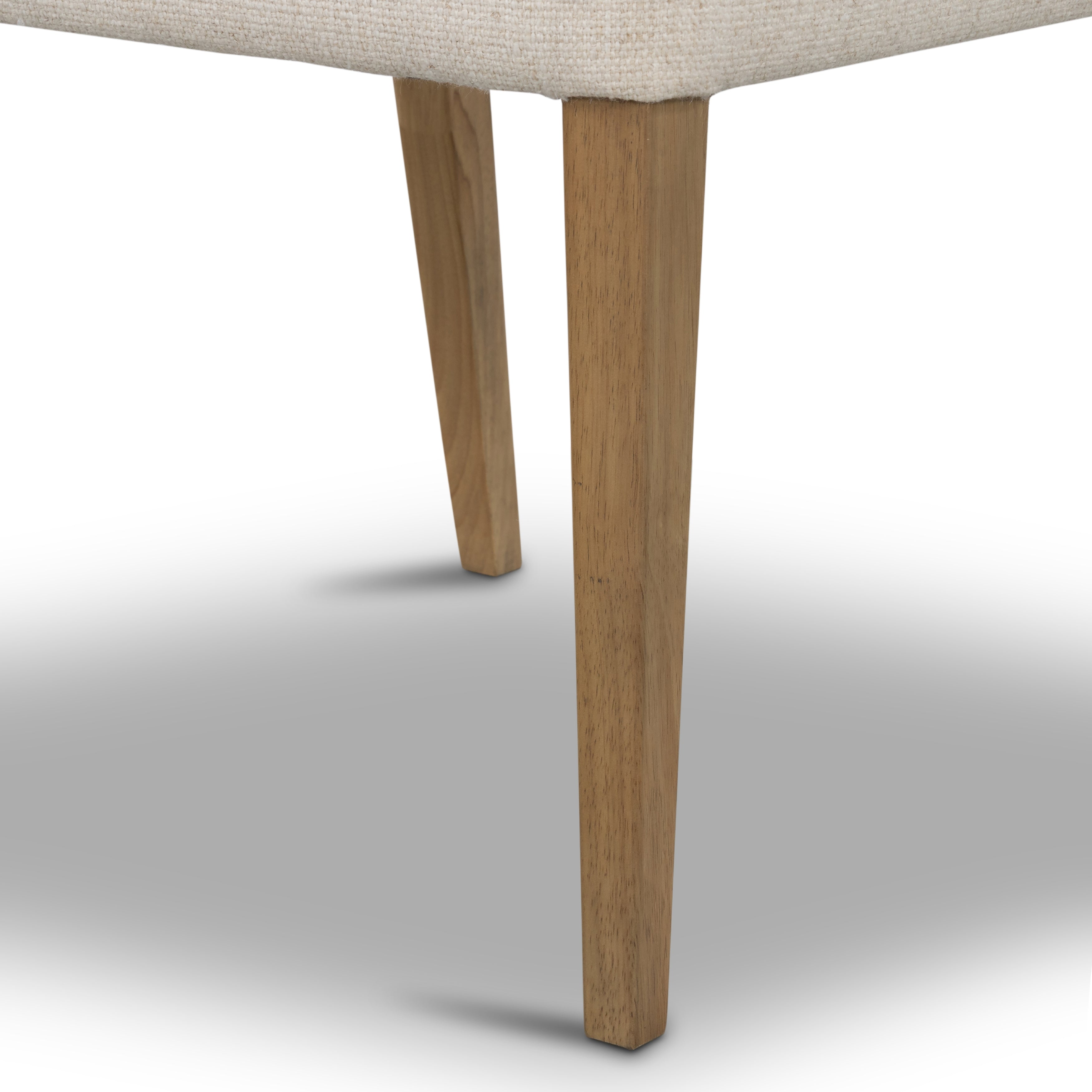 We love the mixed materials found on this Ferris Dining Chair - Winchester Beige. Solid parawood forms a slight, simple frame for squared seating upholstered in high-performance fabric. Tan top-grain leather backing takes this modern-minded dining chair to the next level.  Overall Dimensions: 20.00"w x 21.75"d x 32.00"h