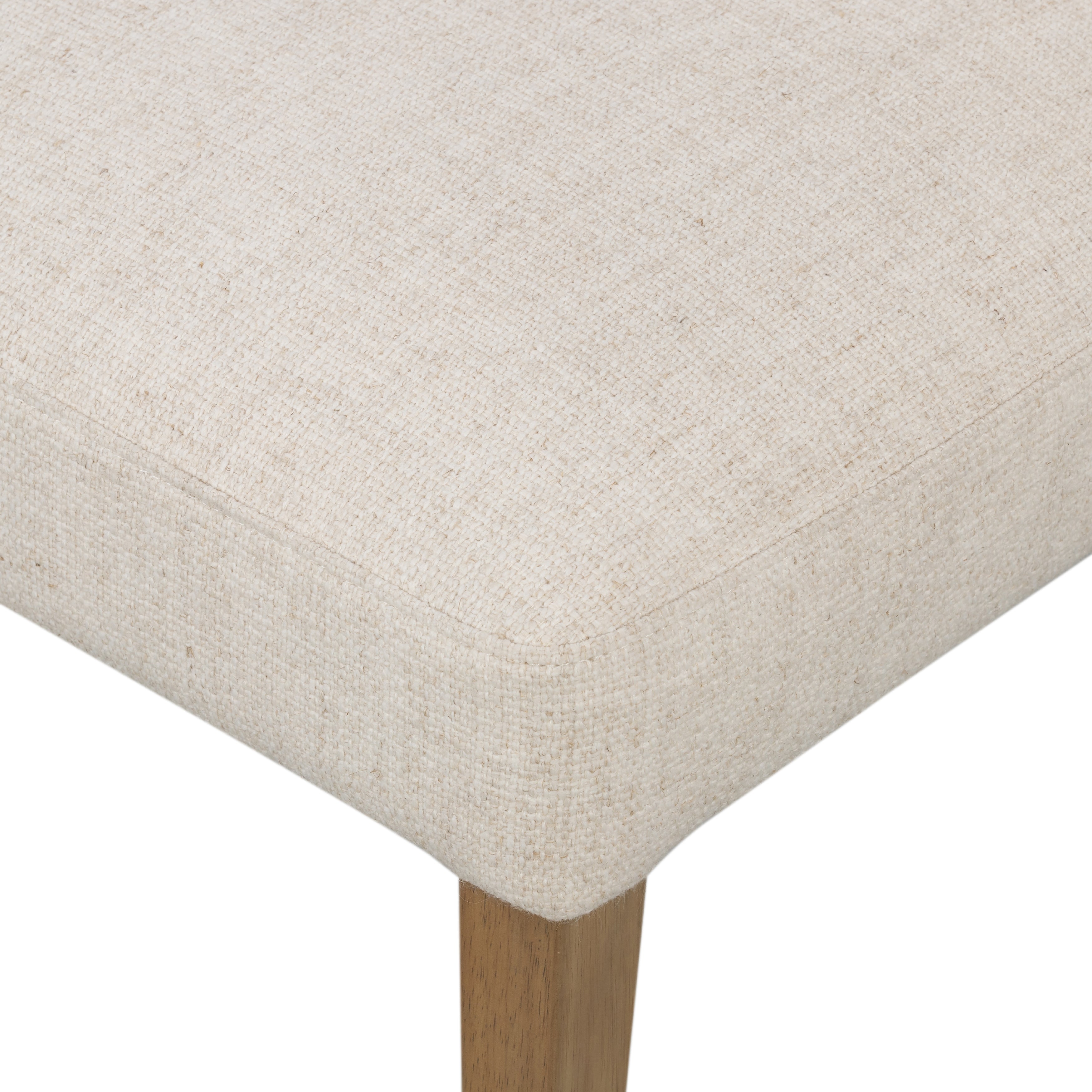 We love the mixed materials found on this Ferris Dining Chair - Winchester Beige. Solid parawood forms a slight, simple frame for squared seating upholstered in high-performance fabric. Tan top-grain leather backing takes this modern-minded dining chair to the next level.  Overall Dimensions: 20.00"w x 21.75"d x 32.00"h