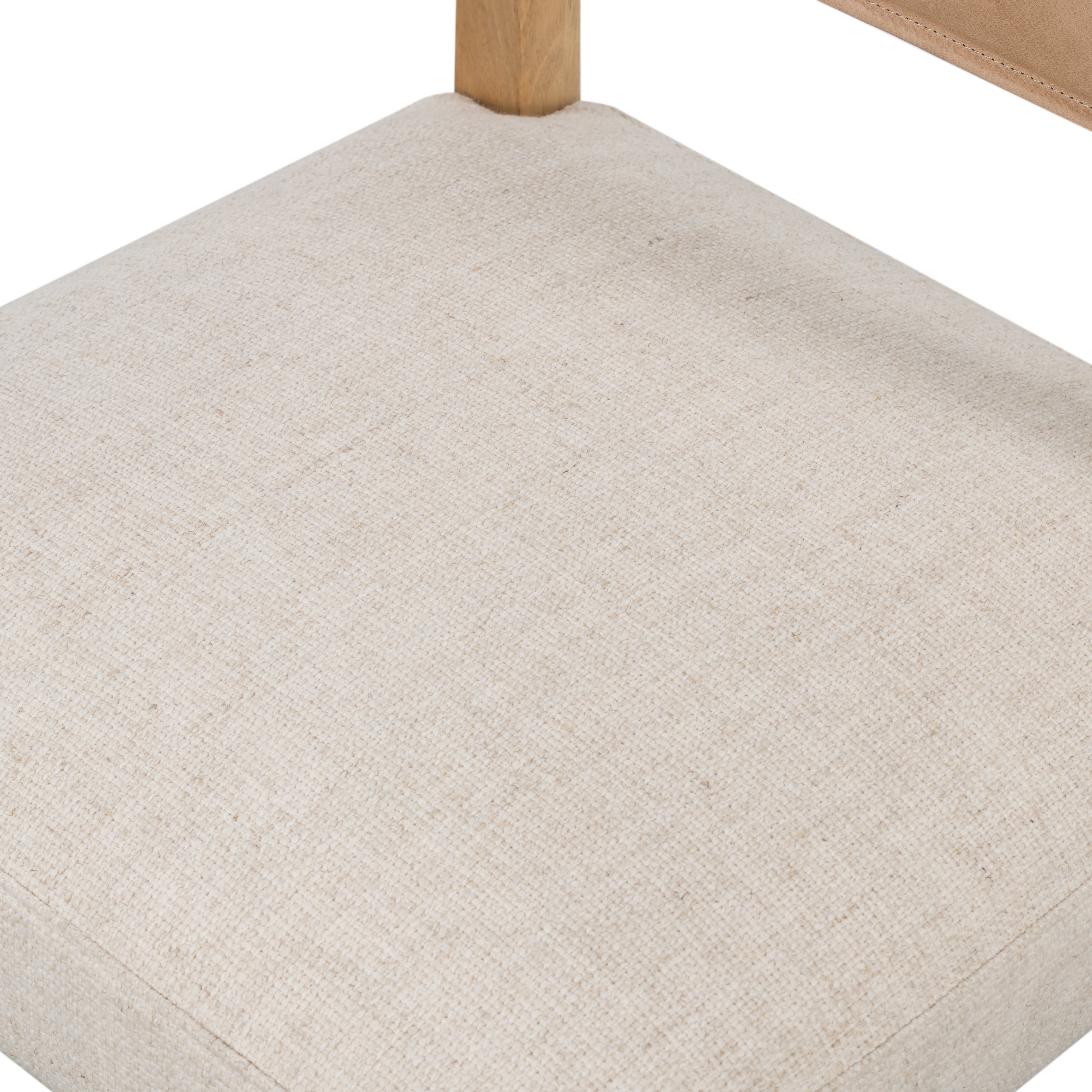 We love the mixed materials found on this Ferris Dining Chair - Winchester Beige. Solid parawood forms a slight, simple frame for squared seating upholstered in high-performance fabric. Tan top-grain leather backing takes this modern-minded dining chair to the next level.  Overall Dimensions: 20.00"w x 21.75"d x 32.00"h