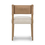 We love the mixed materials found on this Ferris Dining Chair - Winchester Beige. Solid parawood forms a slight, simple frame for squared seating upholstered in high-performance fabric. Tan top-grain leather backing takes this modern-minded dining chair to the next level.  Overall Dimensions: 20.00"w x 21.75"d x 32.00"h