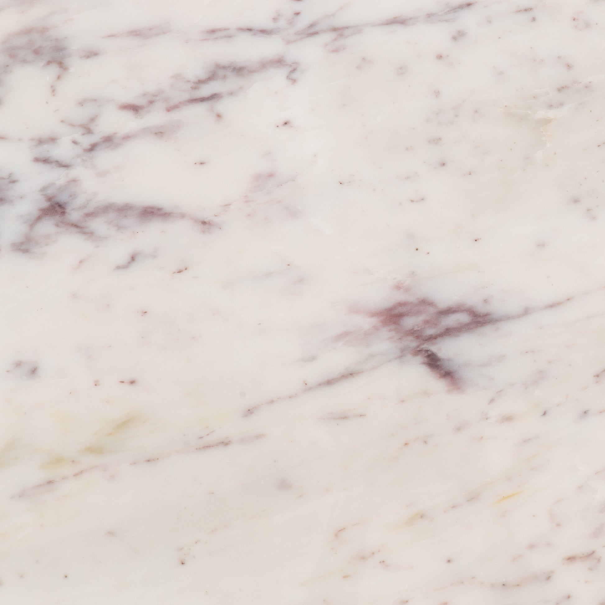 Sophisticated materials take a cue from modern geometry. Cast brass iron forms uniquely-curved angles to balance a contrasting polished white marble top. A refined spin on trend-forward design.  Dimensions: 48"w x 48"d x 30"h, or 60"w x 60"d x 30"h    Colors: Cast Brass, Polished White Marble Materials: Iron, Marble