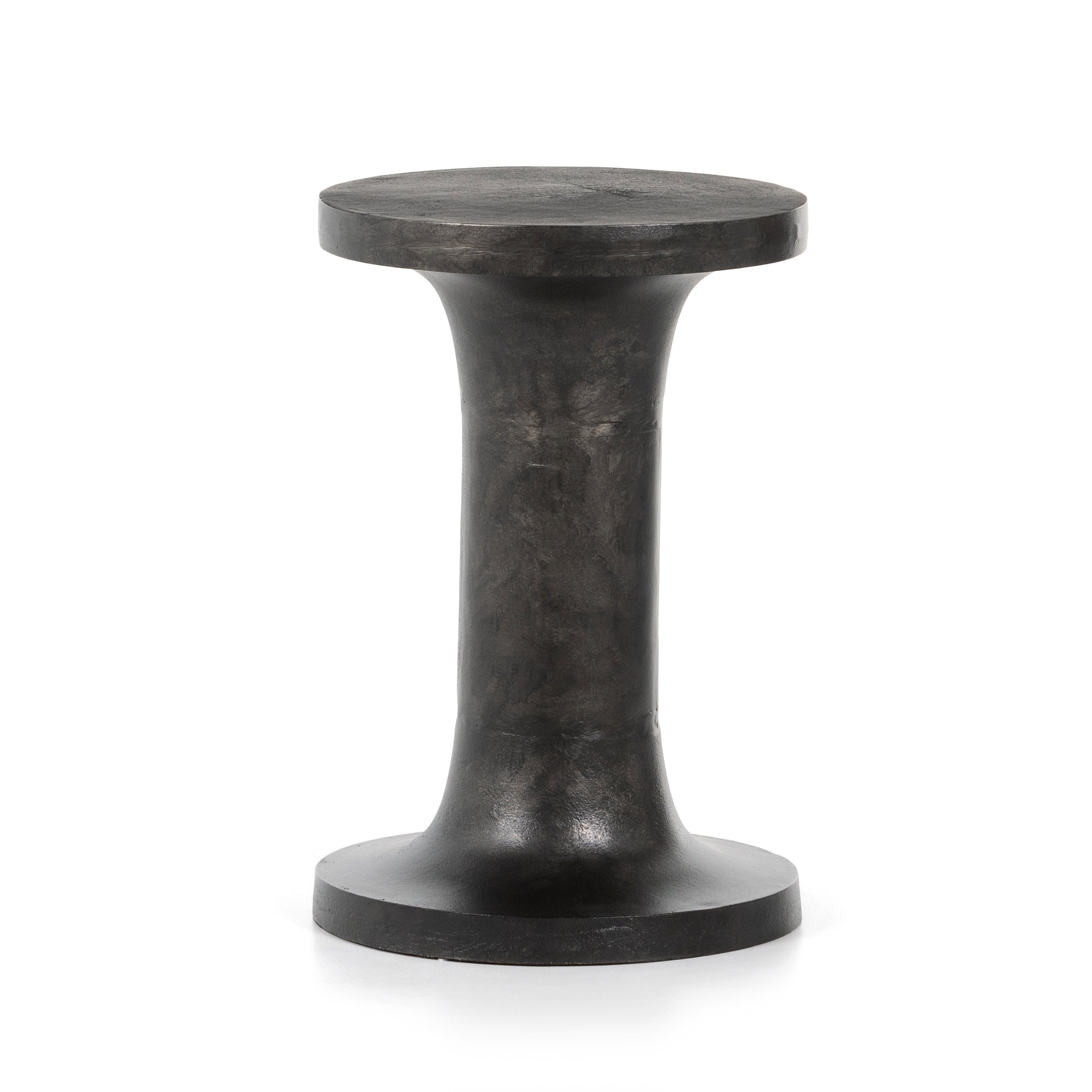 Made from raw black cast aluminum, a dramatically tapered Gino End Table - Raw Black flaunts beautiful high/ low hues and subtle Brutalist vibes. Perfect for setting your book or favorite drink next to.   Overall Dimensions: 13.00"w x 13.00"d x 20.00"h