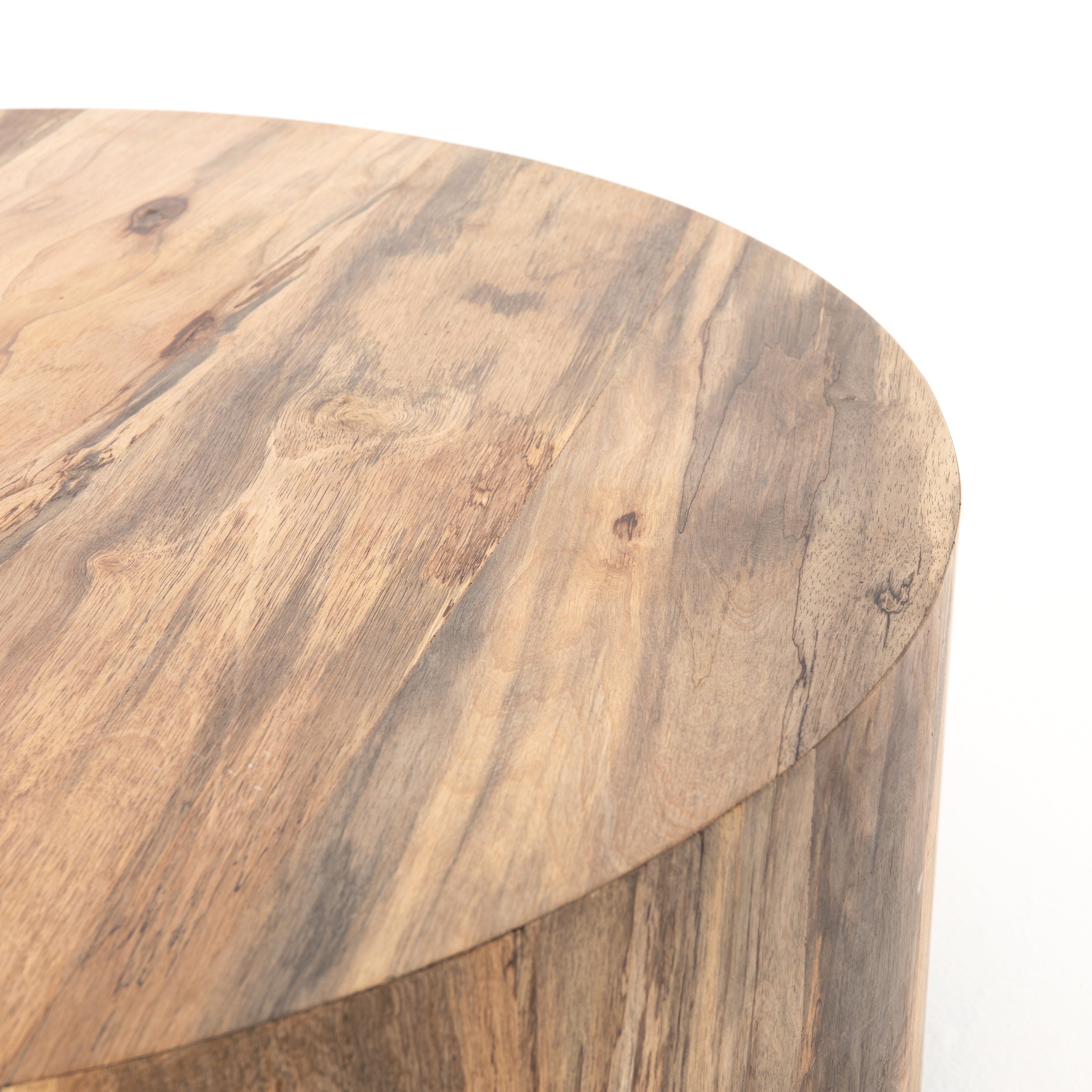 Stunning forces of nature are captured in the Hudson Spalted Primavera Coffee Table. We love how the spalted primavera wood is hand-shaped into a cylindrical silhouette. Reflective of woods' natural character, a slight color variance is possible.   Size: 40"w x 40"d x 15"h  Colors: Gunmetal, Spalted Primavera Materials: Iron, Primavera