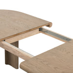 The rounded edges of this Jaylen Extension Dining Table - Yucca Oak are so dreamy. Made from solid oak with an oak veneer, this both a kid friendly and beautiful table to add to any dining room or kitchen area! The extension piece allows entertainment perfect for a few friends or the whole family!   Overall Dimensions: 87.00"w x 42.00"d x 30.00"h