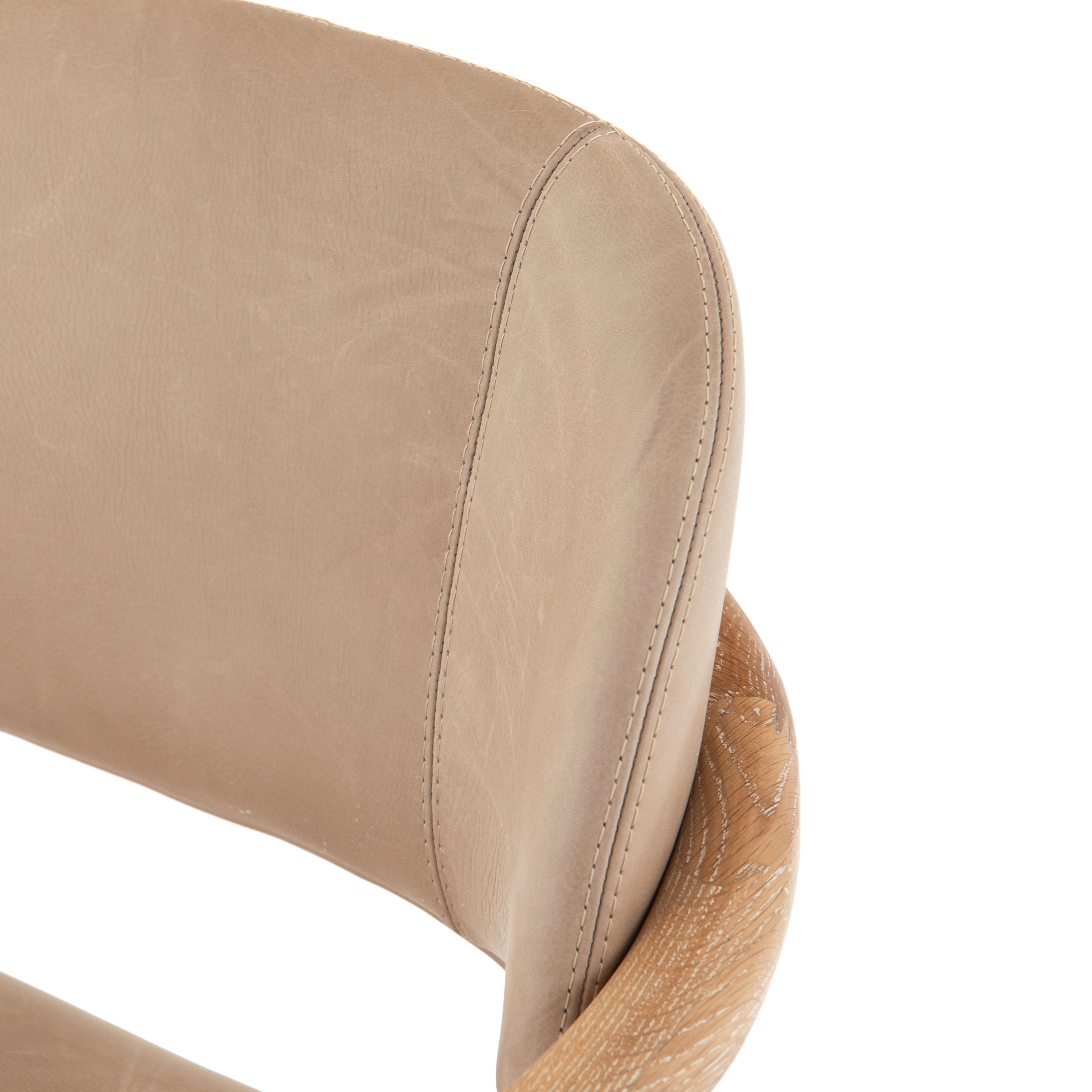 Featuring Josie Dining Chair - Vintage White Wash by Four Hands at Amethyst Home. Mid-century vibes meet modern materials with this Josie Dining Chair - Vintage White Wash. The whitewashed oak frame and float-like seating of top-grain leather add a comfy, light and bright look to any dining room. 
Overall Dimensions: 23"W x 23"L x 32.75"HColors: Harness Burlap.  Amethyst Home provides interior design, new home construction design consulting, vintage area rugs, and lighting in the Omaha metro area.