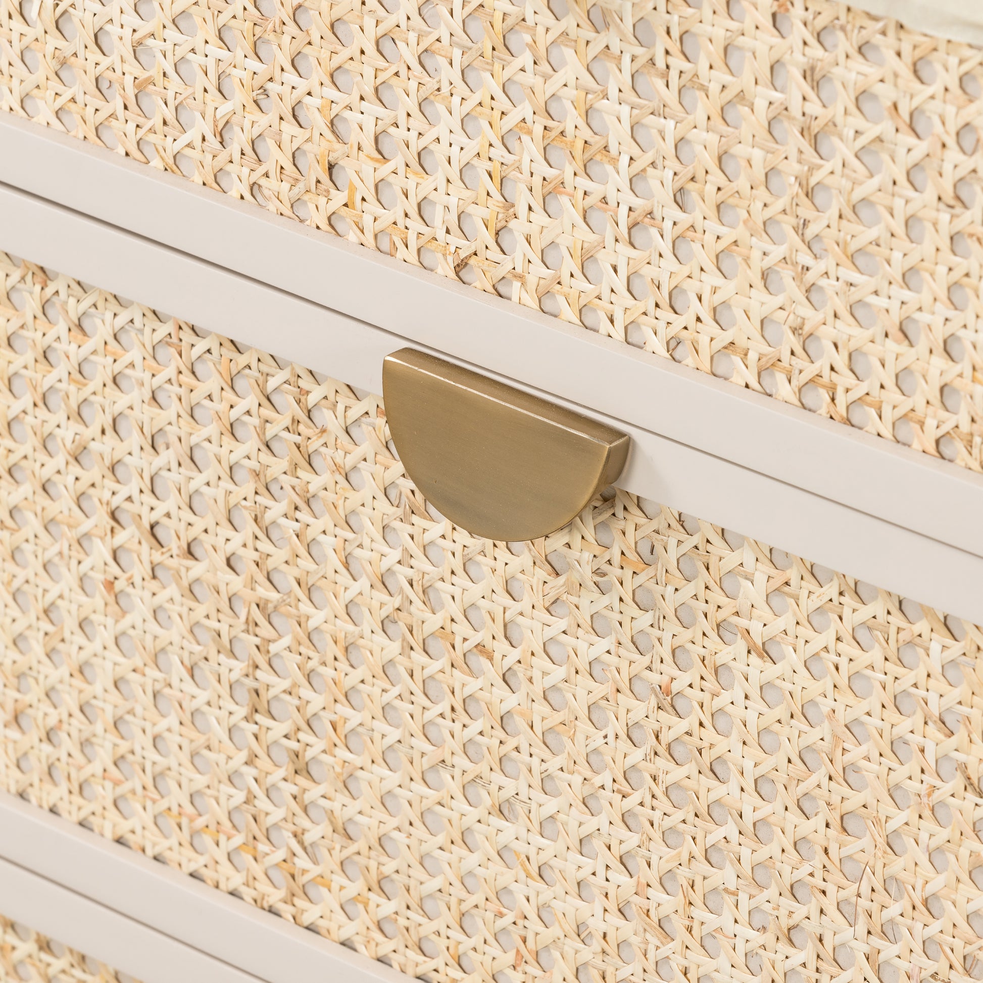 Bring a light look to bedroom styling with this Luella 6 Drawer Dresser - Matte Alabaster. A lacquered six-drawer dresser features woven cane panels and half-moon hardware finished in an aged brass for a beautiful + functional dresser in any bedroom!  Overall Dimensions: 64.00"w x 19.00"d x 33.50"h
