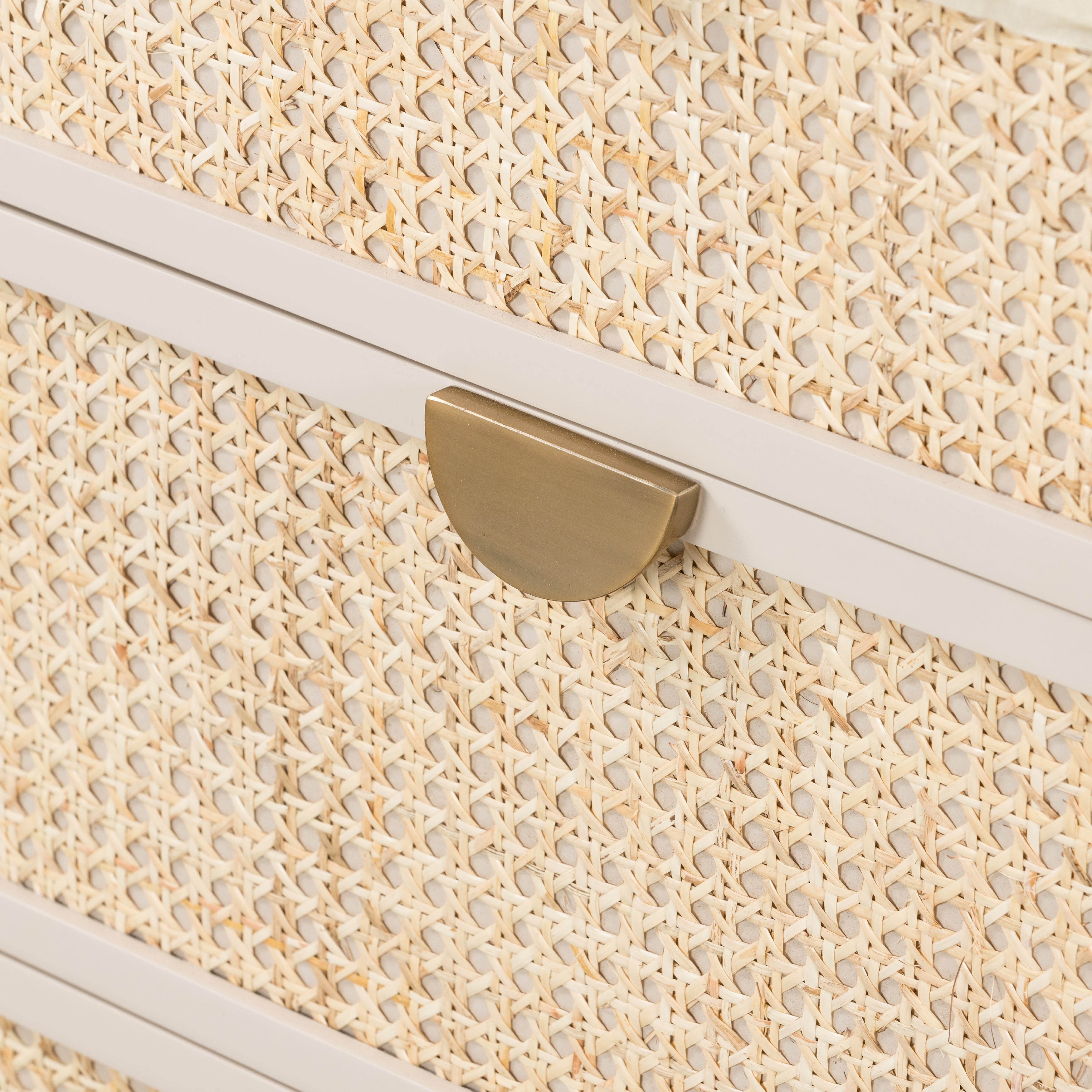 Bring a light look to bedroom styling with this Luella 6 Drawer Dresser - Matte Alabaster. A lacquered six-drawer dresser features woven cane panels and half-moon hardware finished in an aged brass for a beautiful + functional dresser in any bedroom!  Overall Dimensions: 64.00"w x 19.00"d x 33.50"h