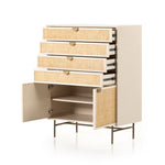 Featuring Luella Tall Dresser - Matte Alabaster by Four Hands at Amethyst Home. Bring a light look to bedroom styling with this Luella Tall Dresser - Matte Alabaster. A tall, lacquered dresser features woven cane panels and half-moon hardware finished in an aged brass. Four drawers plus cabinetry with interior shelving for generous storage space for any be.  Amethyst Home provides interior design, new home construction design consulting, vintage area rugs, and lighting in the Calabasas metro area.