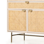 Featuring Luella Tall Dresser - Matte Alabaster by Four Hands at Amethyst Home. Bring a light look to bedroom styling with this Luella Tall Dresser - Matte Alabaster. A tall, lacquered dresser features woven cane panels and half-moon hardware finished in an aged brass. Four drawers plus cabinetry with interior shelving for generous storage space for any bedroo.  Amethyst Home provides interior design, new home construction design consulting, vintage area rugs, and lighting in the Tampa metro area.