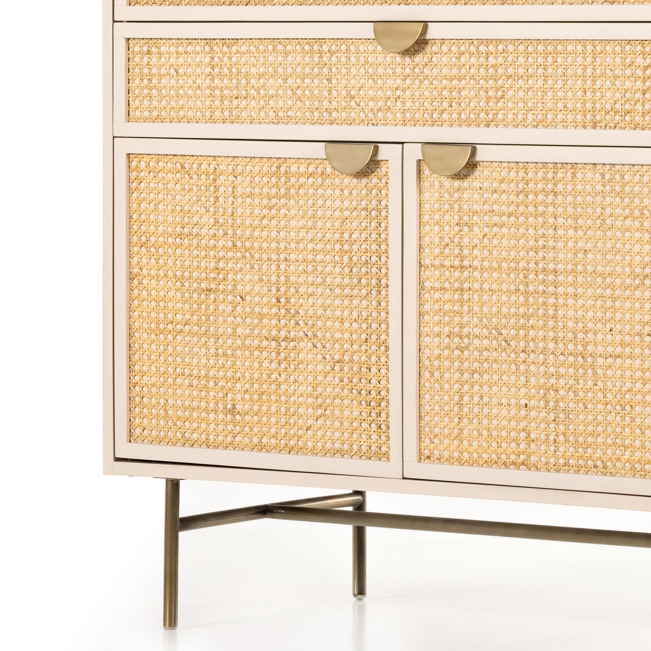 Featuring Luella Tall Dresser - Matte Alabaster by Four Hands at Amethyst Home. Bring a light look to bedroom styling with this Luella Tall Dresser - Matte Alabaster. A tall, lacquered dresser features woven cane panels and half-moon hardware finished in an aged brass. Four drawers plus cabinetry with interior shelving for generous storage space for any bedroo.  Amethyst Home provides interior design, new home construction design consulting, vintage area rugs, and lighting in the Tampa metro area.