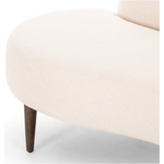 This curvy, Italian-inspired Luna Chaise exudes attitude. This features exclusive performance-grade ivory boucle in a striking, sultry S shape. Dual pillows for a fine finishing touch for any bedroom, office, or living room.  Overall Dimensions: 70.00"w x 35.00"d x 30.00"h