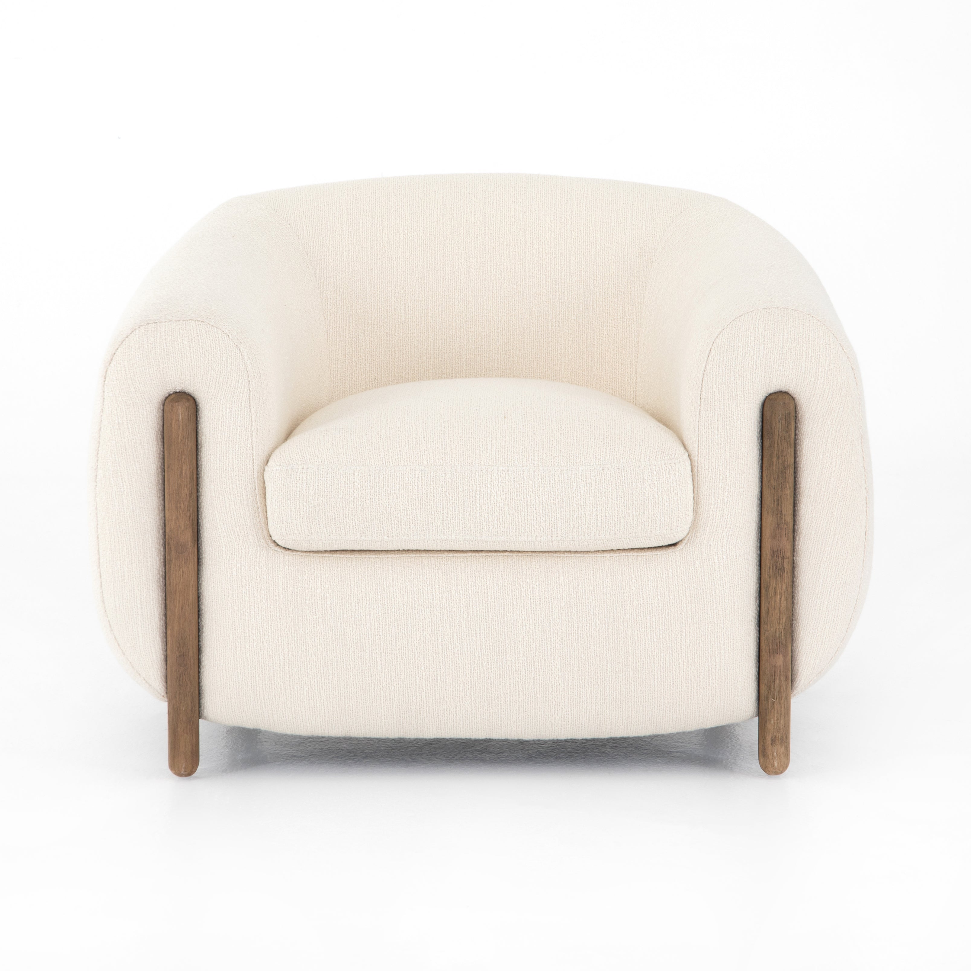 A fresh take on the traditional tub chair, this Lyla Chair - Kerbey Ivory has an exaggerated depth for drama and comfort. Solid rubberwood legs intersect ivory upholstery for clean contrast of color and scale. A comfy, gorgeous chair to add to any living room, office, or other space.   Overall Dimensions: 38.00"w x 33.00"d x 28.00"h