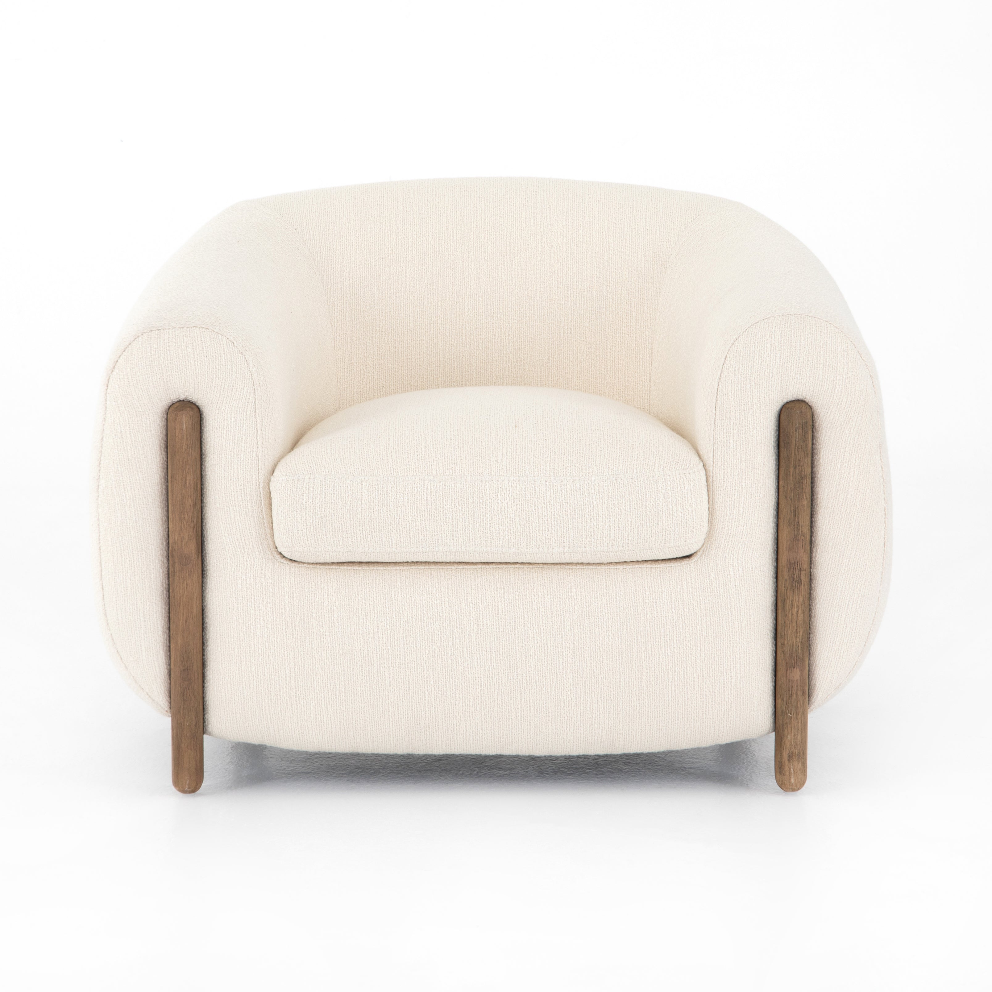 A fresh take on the traditional tub chair, this Lyla Chair - Kerbey Ivory has an exaggerated depth for drama and comfort. Solid rubberwood legs intersect ivory upholstery for clean contrast of color and scale. A comfy, gorgeous chair to add to any living room, office, or other space.   Overall Dimensions: 38.00"w x 33.00"d x 28.00"h