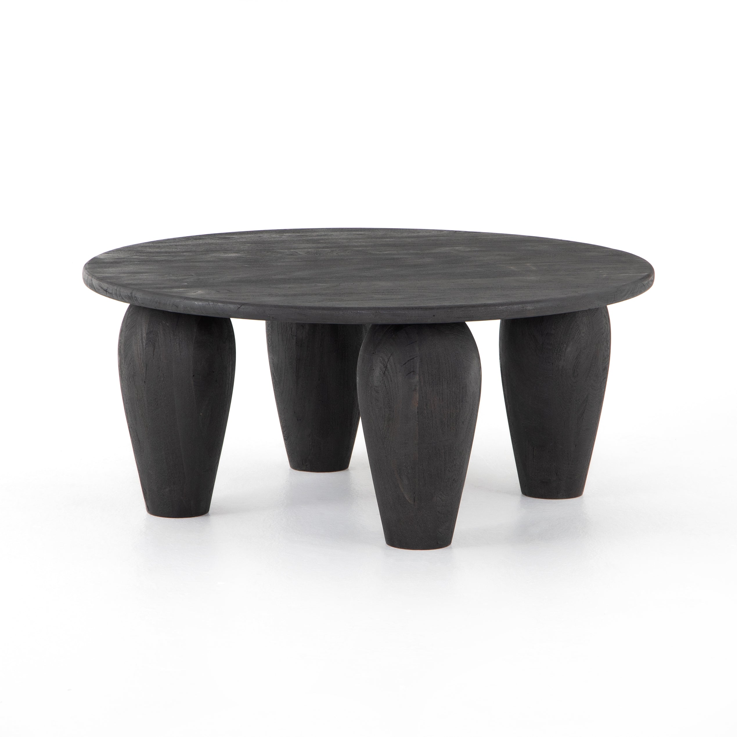 We love the shapely, substantial legs that support a slim, rounded tabletop of light black-finished reclaimed woods in this Maricopa Coffee Table - Dark Totem. A global, organic look with a handcrafted vibe.