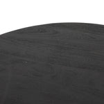 We love the shapely, substantial legs that support a slim, rounded tabletop of light black-finished reclaimed woods in this Maricopa Coffee Table - Dark Totem. A global, organic look with a handcrafted vibe.
