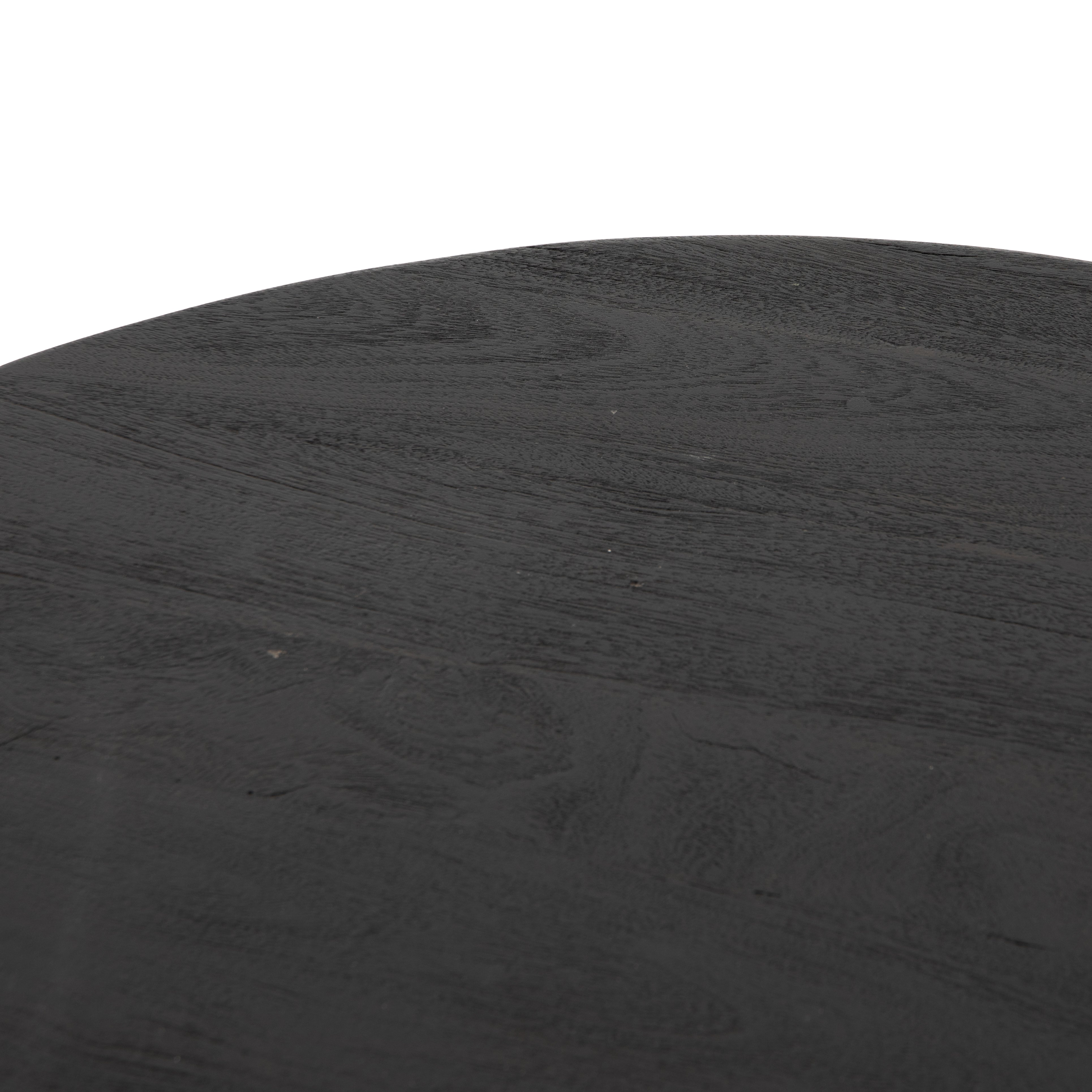 We love the shapely, substantial legs that support a slim, rounded tabletop of light black-finished reclaimed woods in this Maricopa Coffee Table - Dark Totem. A global, organic look with a handcrafted vibe.