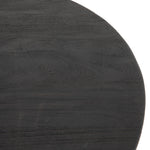 We love the shapely, substantial legs that support a slim, rounded tabletop of light black-finished reclaimed woods in this Maricopa Coffee Table - Dark Totem. A global, organic look with a handcrafted vibe.