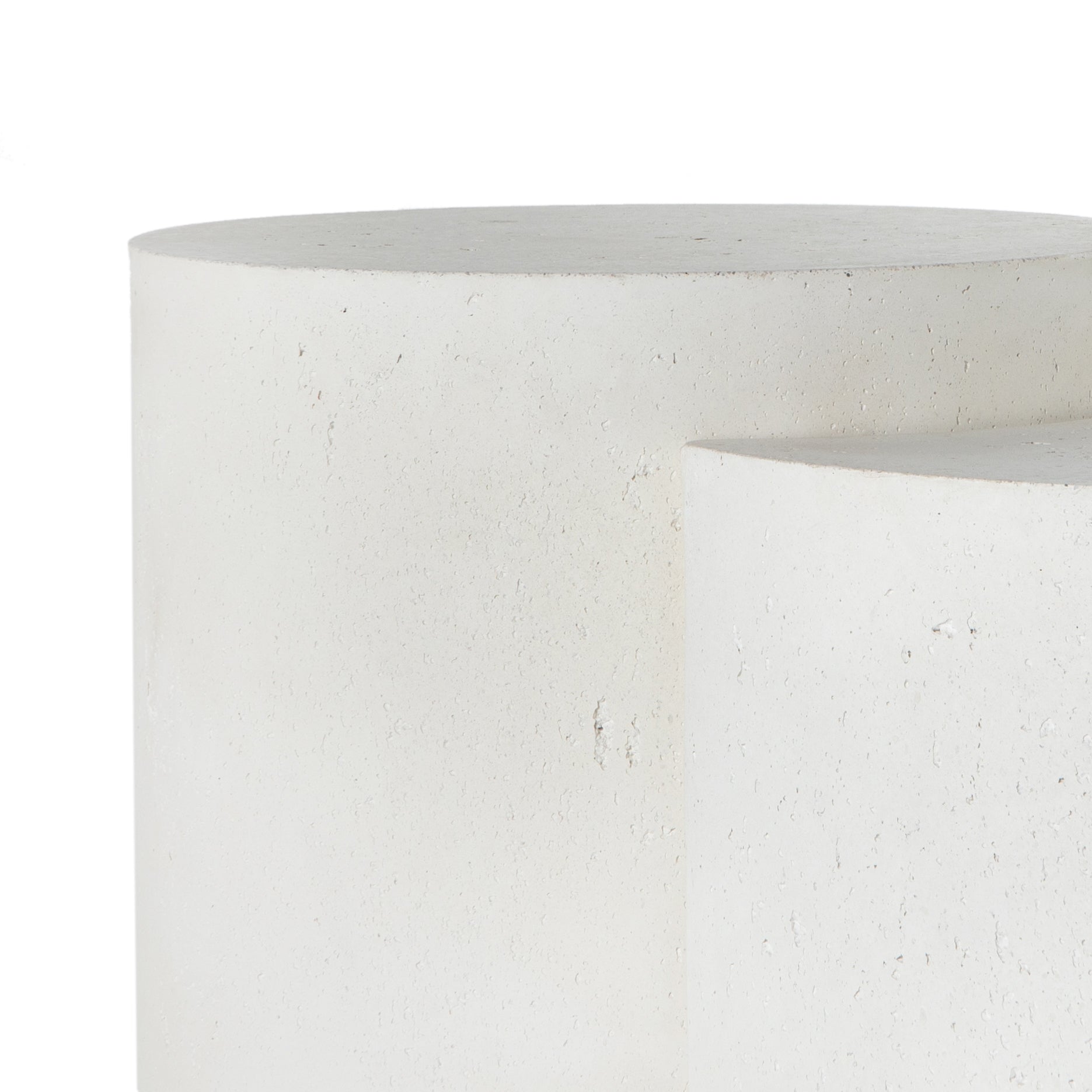 Made from white-finished concrete with deep, textured pitting, this Meza Nesting Coffee Table - Textured White is sturdy and beautiful. Inspired by mid-century coral décor, this nesting coffee table features two tiers for a layered look with modernity.  Overall Dimensions: 43.75"w x 28.25"d x 19.00"h