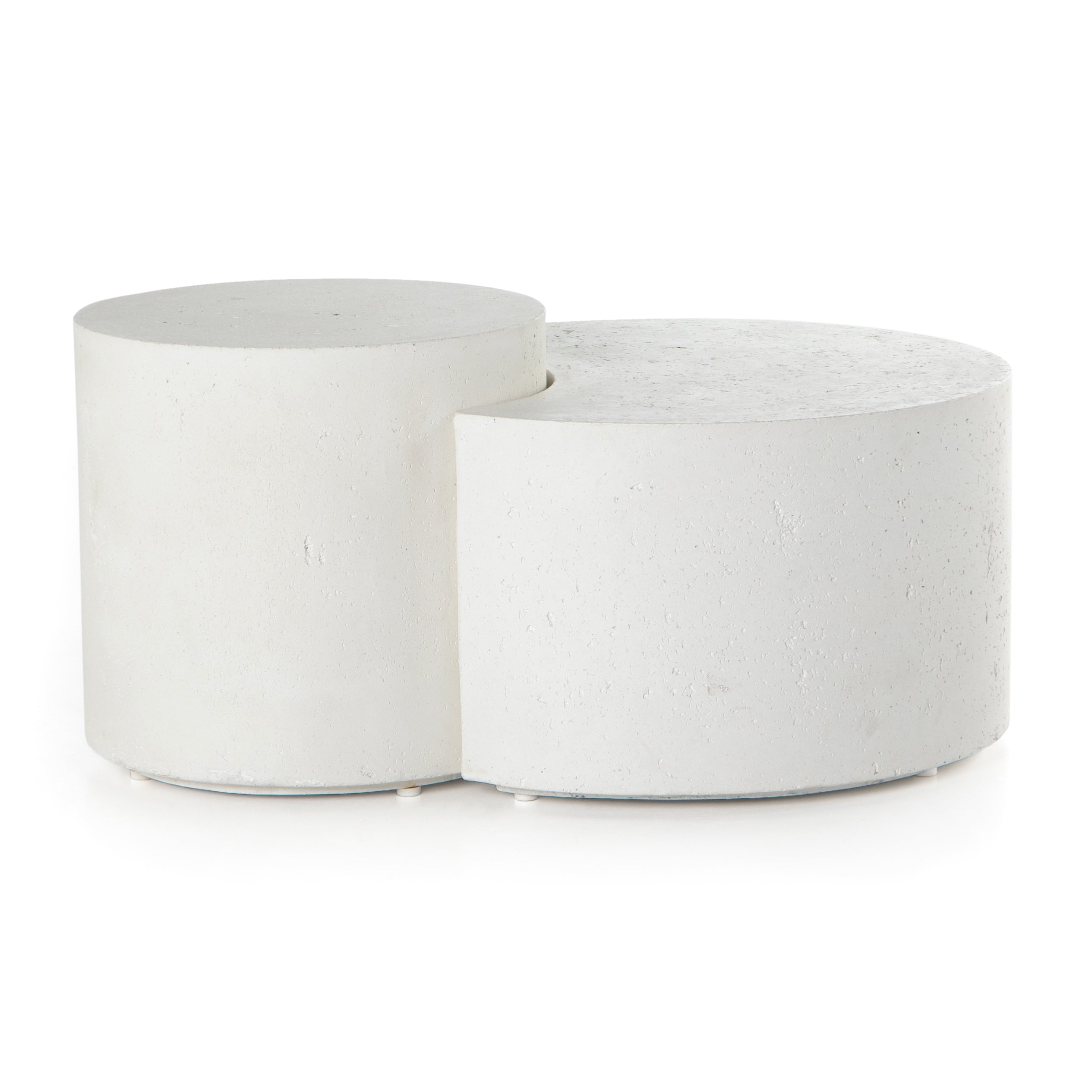 Made from white-finished concrete with deep, textured pitting, this Meza Nesting Coffee Table - Textured White is sturdy and beautiful. Inspired by mid-century coral décor, this nesting coffee table features two tiers for a layered look with modernity.  Overall Dimensions: 43.75"w x 28.25"d x 19.00"h