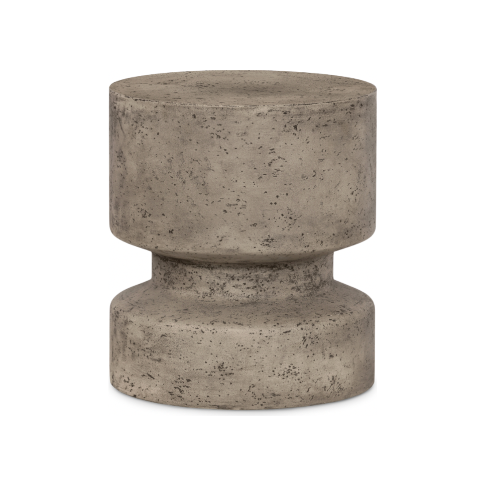 Made from solid concrete, this Nahla Outdoor End Table - Graphite is both sturdy and durable. Perfect for layering in as a sturdy extra surface, indoors or out. Distressing will vary slightly from piece to piece, given concrete's organic nature. Cover or store inside during inclement weather and when not in use.  Overall Dimensions: 15.75"w x 15.75"d x 17.75"h