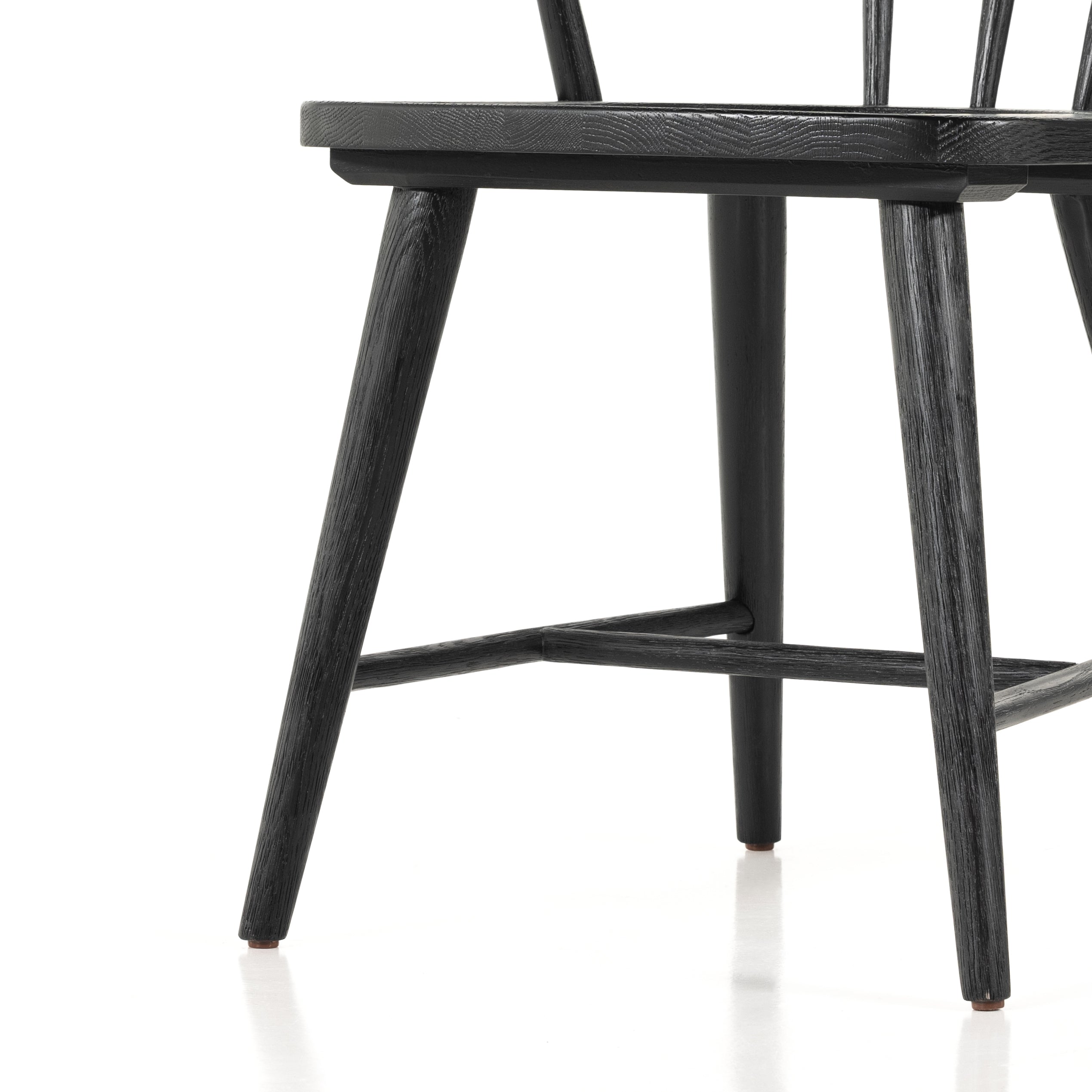 This Naples Dining Chair - Black Oak is a fresh twist on traditional Windsor-style seating is crafted from solid black-finished oak, for a look that’s always in style.  Overall Dimensions: 20.50"w x 21.50"d x 31.75"h