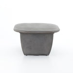This Naya Outdoor Coffee Table is modern and curve-driven. Dark grey concrete forms a rounded rectangle top with bullnose edging, reminiscent of a shapely surfboard.  Cover or store inside during inclement weather.  Overall Dimensions: 46.00"w x 28.00"d x 16.00"h