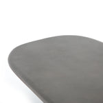 This Naya Outdoor Coffee Table is modern and curve-driven. Dark grey concrete forms a rounded rectangle top with bullnose edging, reminiscent of a shapely surfboard.  Cover or store inside during inclement weather.  Overall Dimensions: 46.00"w x 28.00"d x 16.00"h